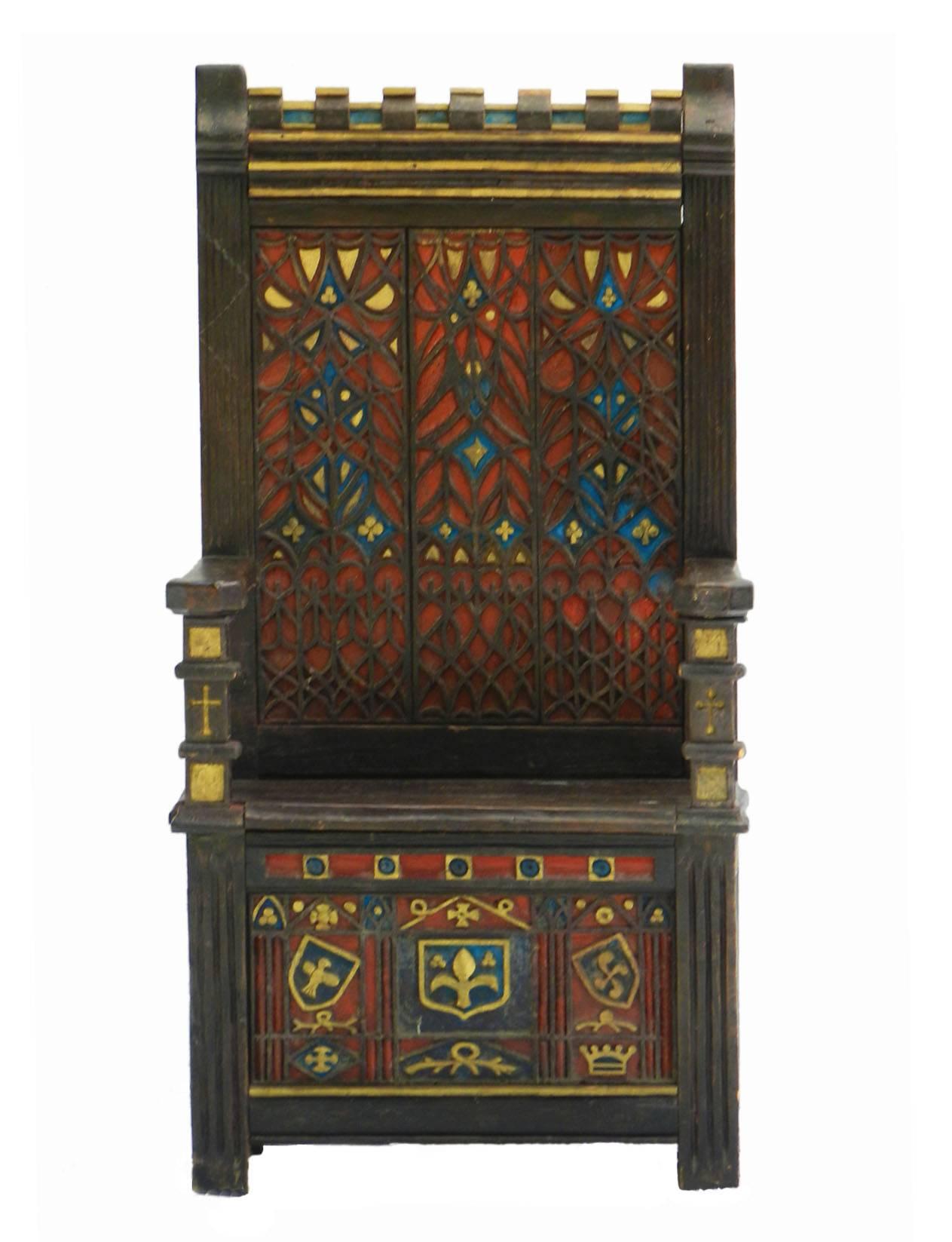 Arts and Crafts monks bench throne chair, circa 1910-1920
All original
Stunning character feature chair 
Carved oak Gothic Revival
French Folk Art
With Basque Celtic crosses
Polychrome ottoman 
Seat rises for storage
Hall chair
From a small French