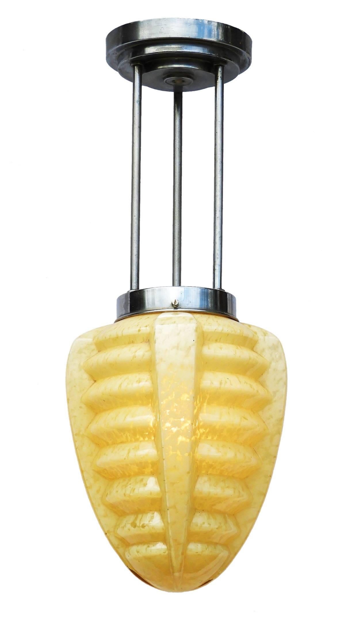 Stunning Art Deco ceiling light, mottled buttermilk yellow glass shade on a chrome three stemmed fixed pendant fitting. 
In good original condition with no losses to glass.
This will be re-wired and tested to USA or UK and European standards