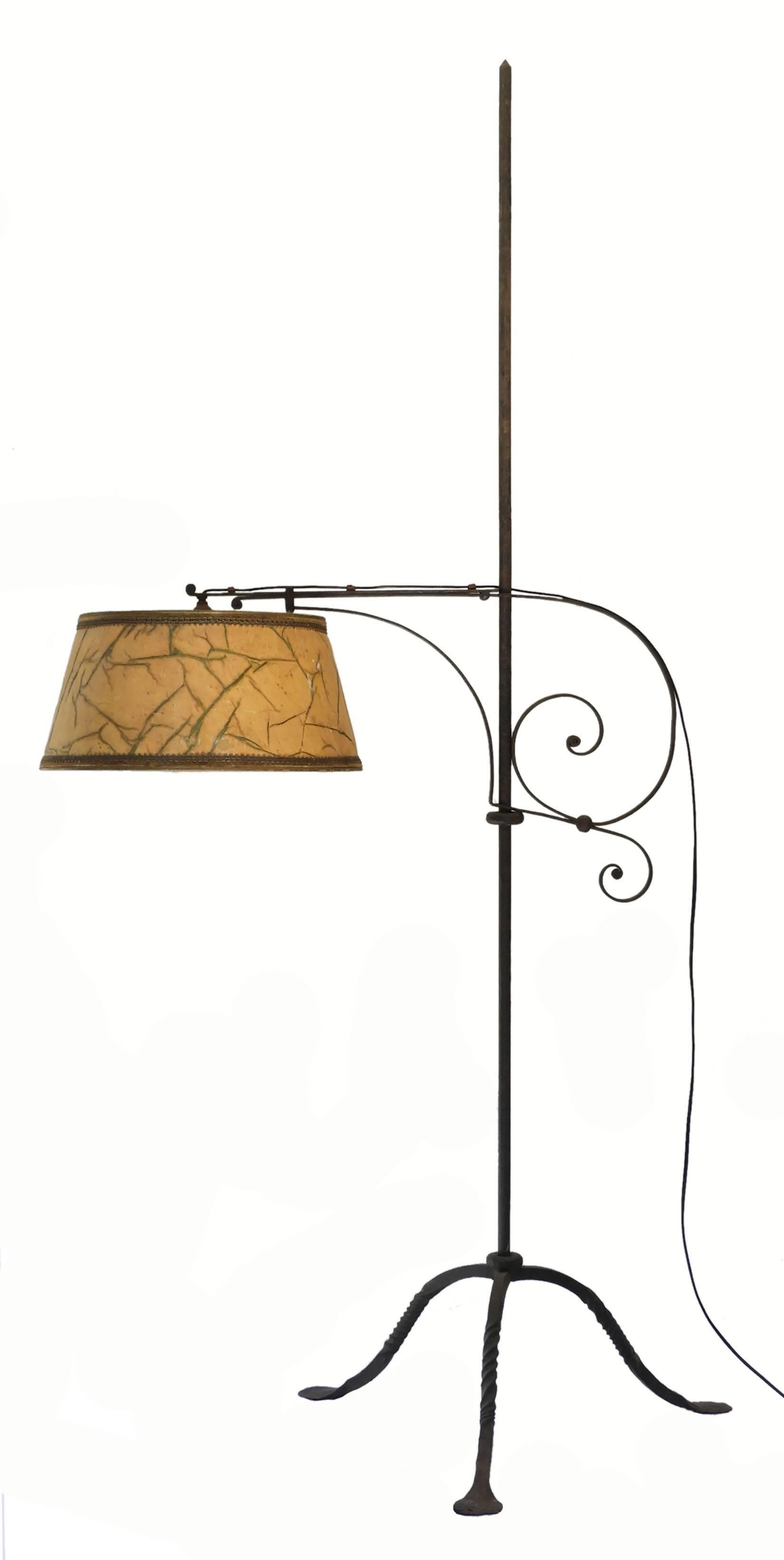 Arts and Crafts adjustable wrought iron floor lamp
Original, circa 1910 Standard Lamp 
Charming lamp where both the height and reach can be adjusted as required
Pictured with original lampshade It will equally take a lampshade of your choice or a