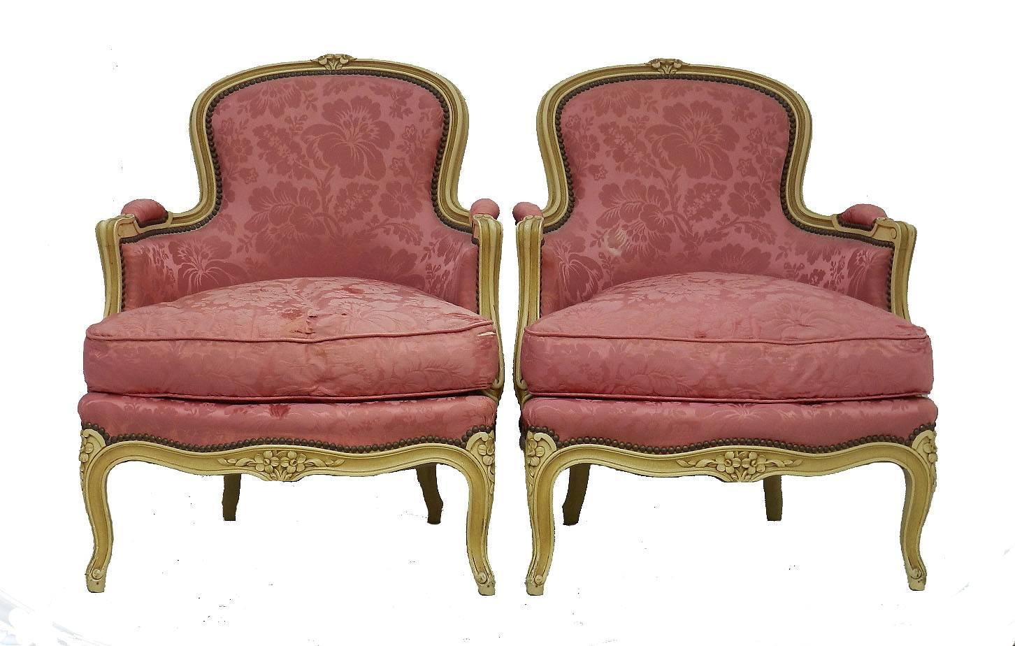 Pair Bergere Armchairs Louis XV revival French early 20th century  to recover
Upholstered with original feather cushions
Original craquelure finish
Upholstery is sound 
The original silk covers are shredding and the cushion covers are deteriorating