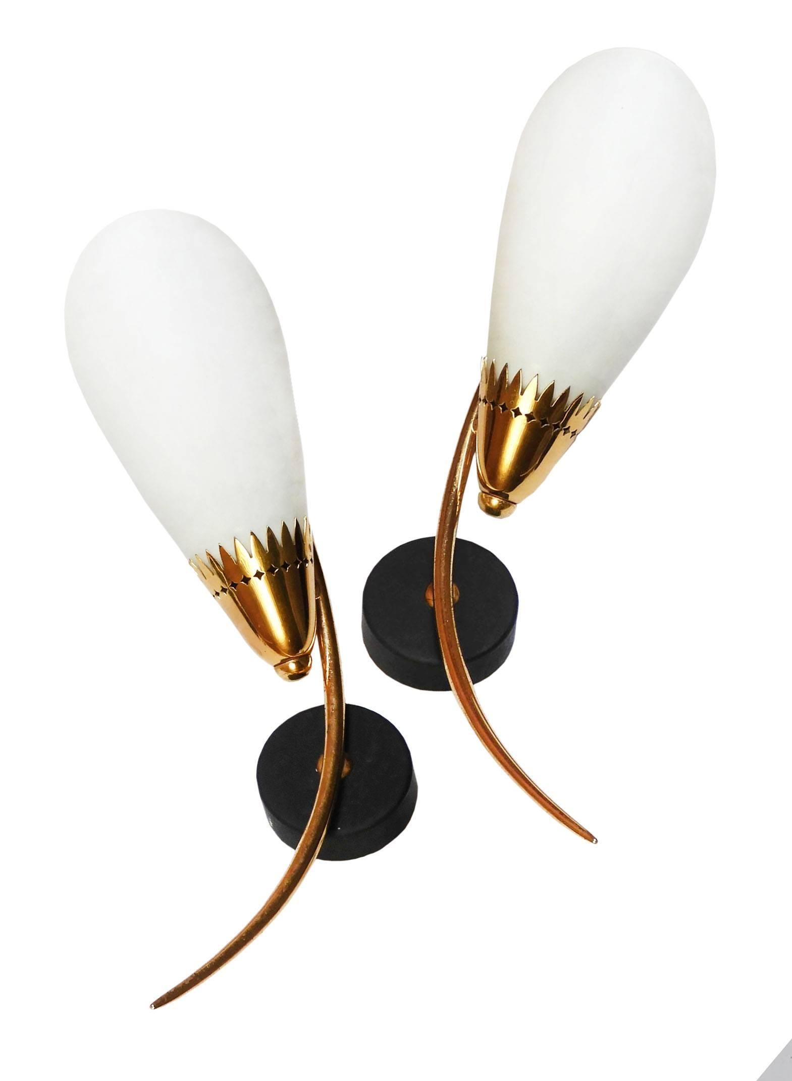 Pair of midcentury Maison Arlus wall light sconces appliques France, circa 1950-1960
Stilnovo style
Original white Opaline glass shades
with varigated brass collar details.
Good condition with only minor signs of wear for their age.
These will be