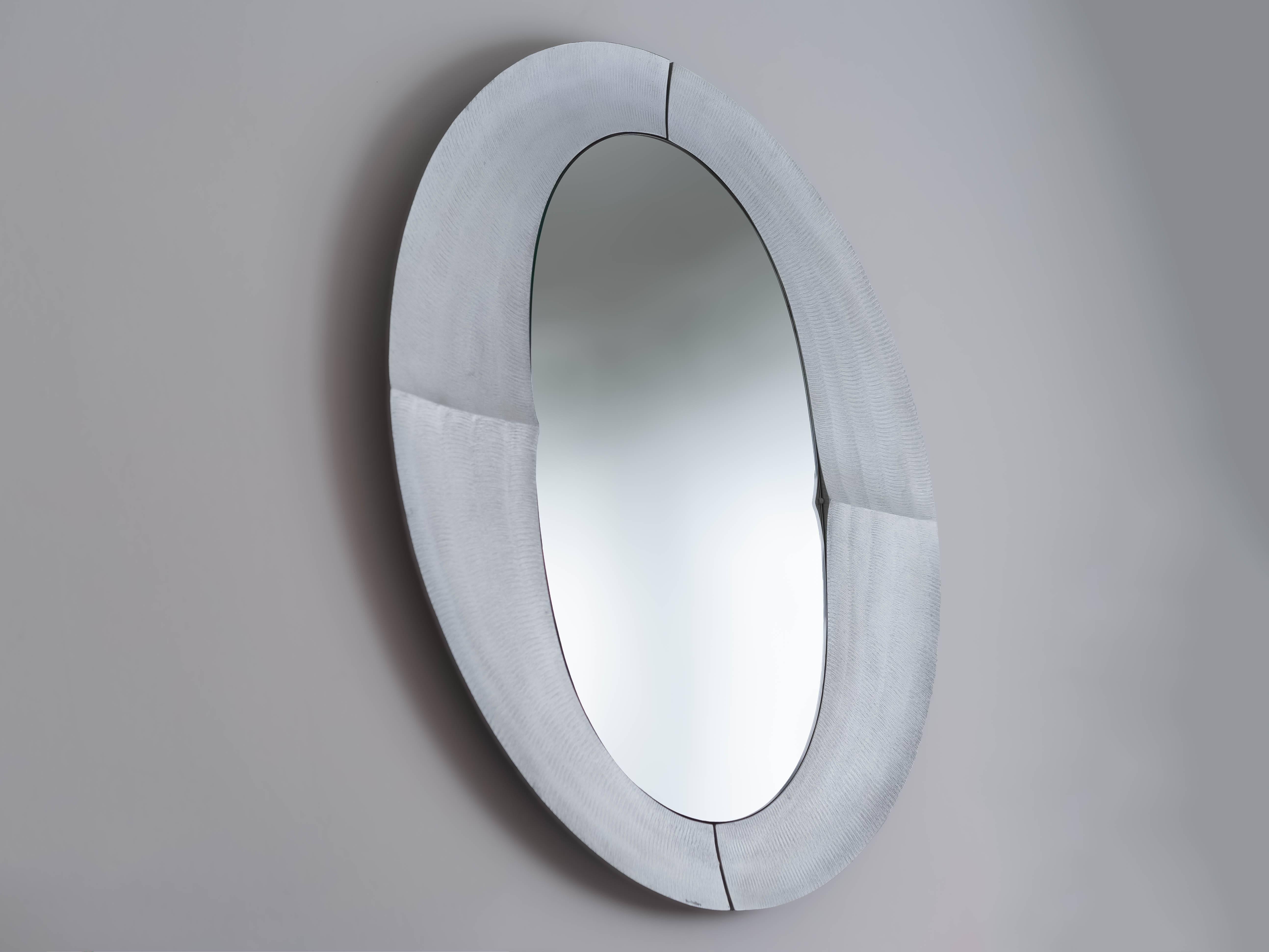 A stunning etched aluminium mirror by Lorenzo Burchiellaro produced by his Atelier Burchiellaro workshop in the 1970s. A master of metalwork and the use of unique surface treatments, Burchiellaro continuously researched new techniques to achieve