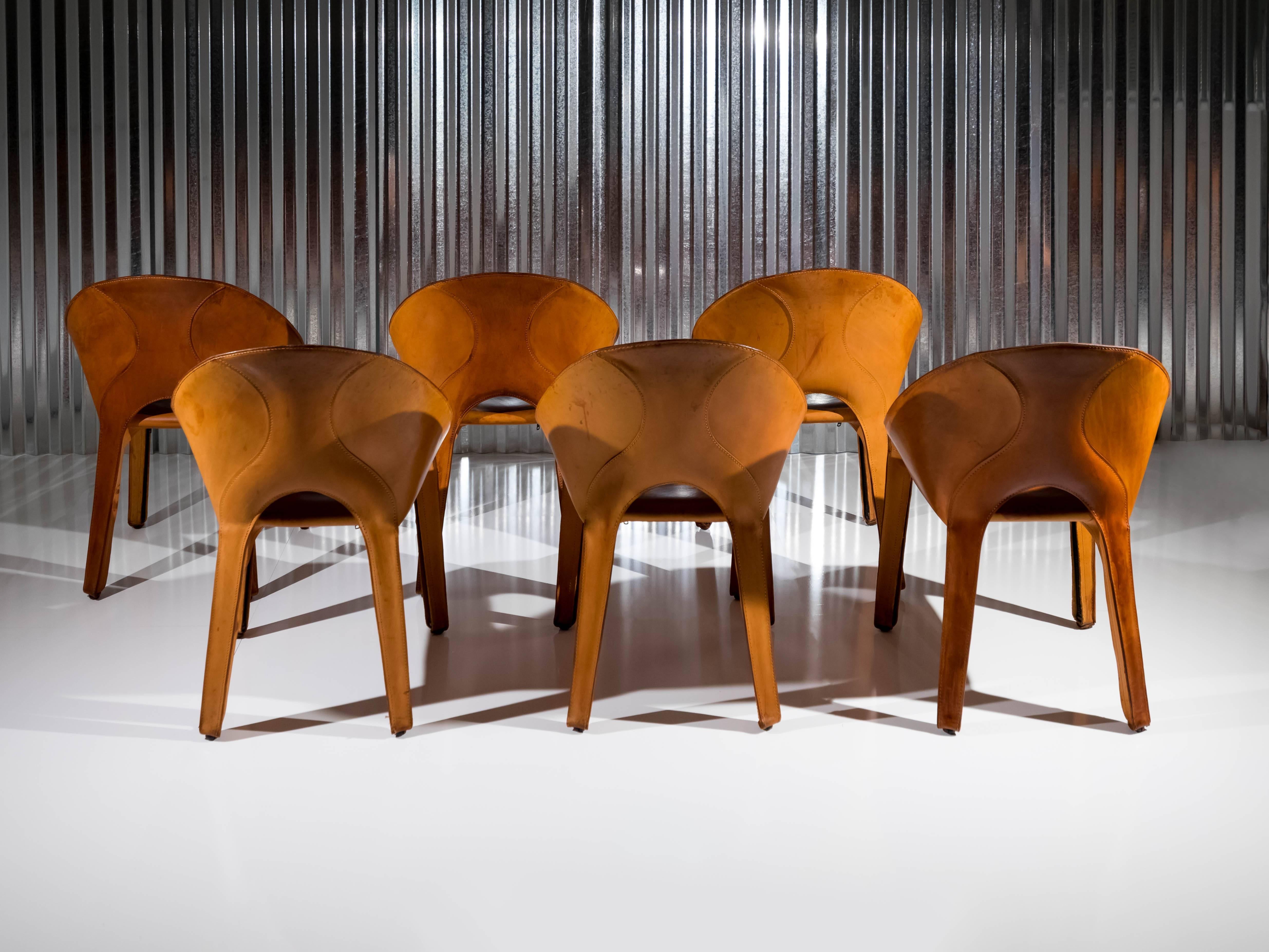 A fantastic and rare set of six 'Lira' chairs designed by Mario Bellini for Cassina in 1989. An evolution of his Cab chair design from 1977, the "Lira" chairs are made from saddle stitched leather that is placed over a metal structure,