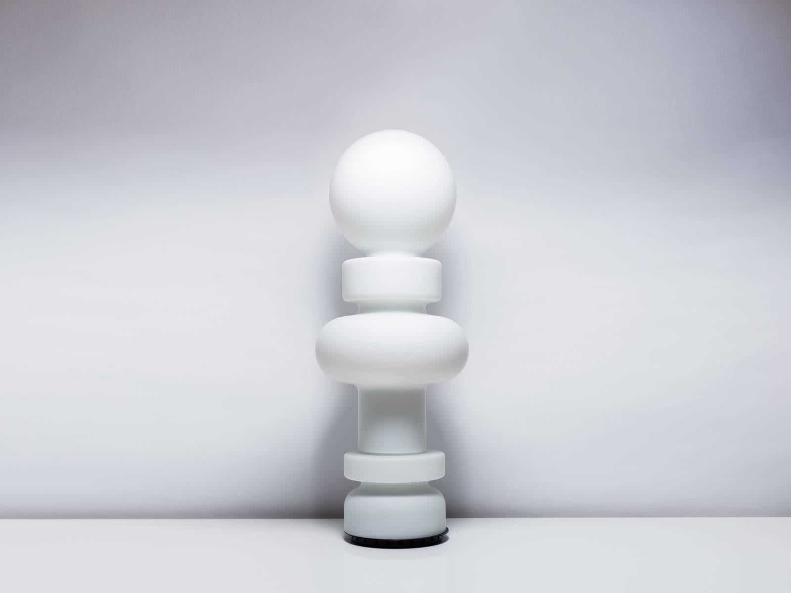 Impressively scaled mid-height floor lamp comprised of three pieces of milky-white glass. Designed by artist and theorist Bobo Piccoli for Fontana Arte in 1968, the 