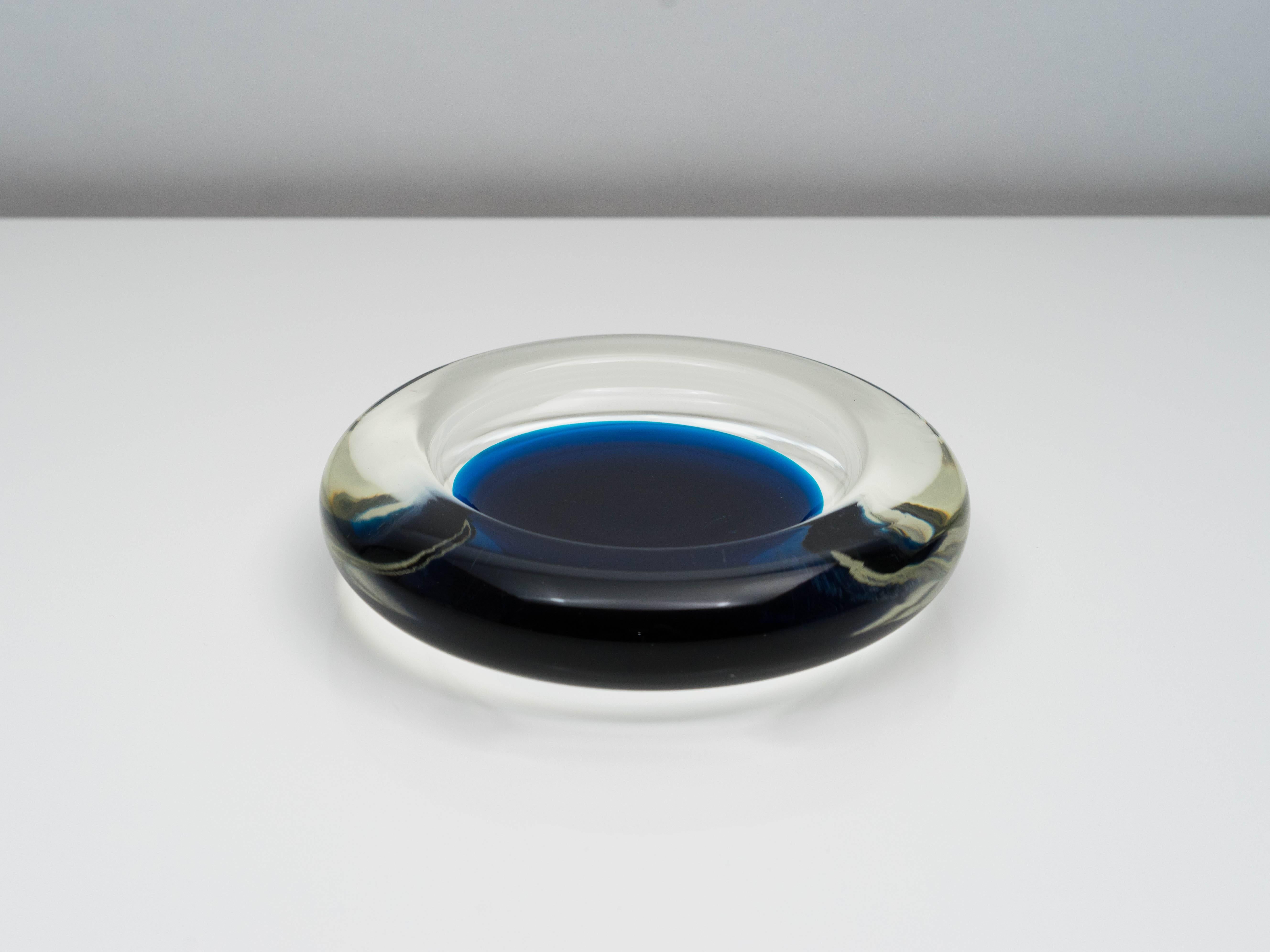 Beautiful large blue and clear glass ashtray or dish designed by Ludovico Diaz de Santillana for Venini's collaboration with Pierre Cardin in 1968-1970. This example was produced in 1980.