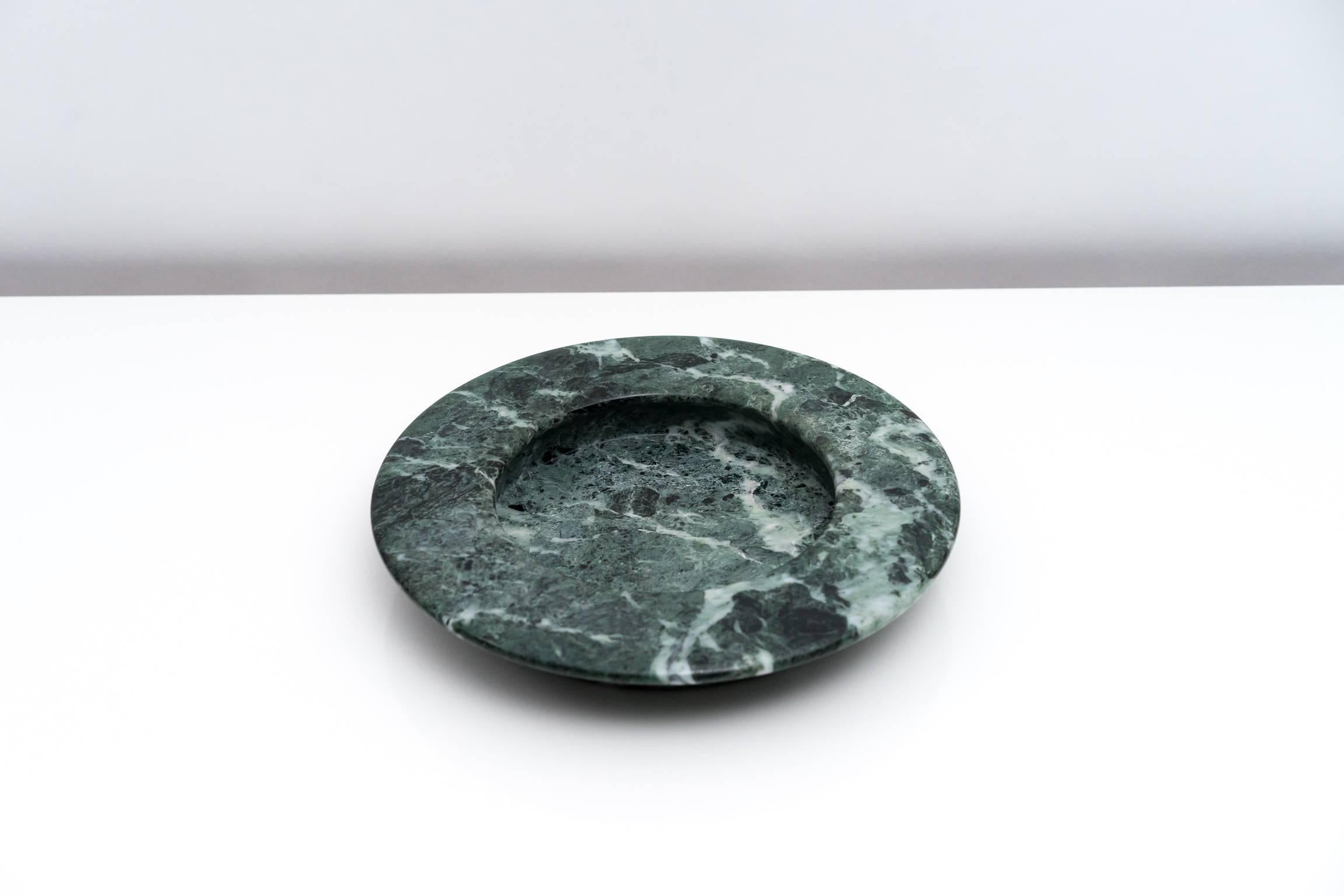 Wide rimmed verde alpi marble dish designed by Egidio di Rosa and Pier Alessandro Giusti for stone specialists Up & Up in 1982. The expertly sculpted 'Mod. 50/10' is made from a single piece of marble with a wide overhang. The clean lines