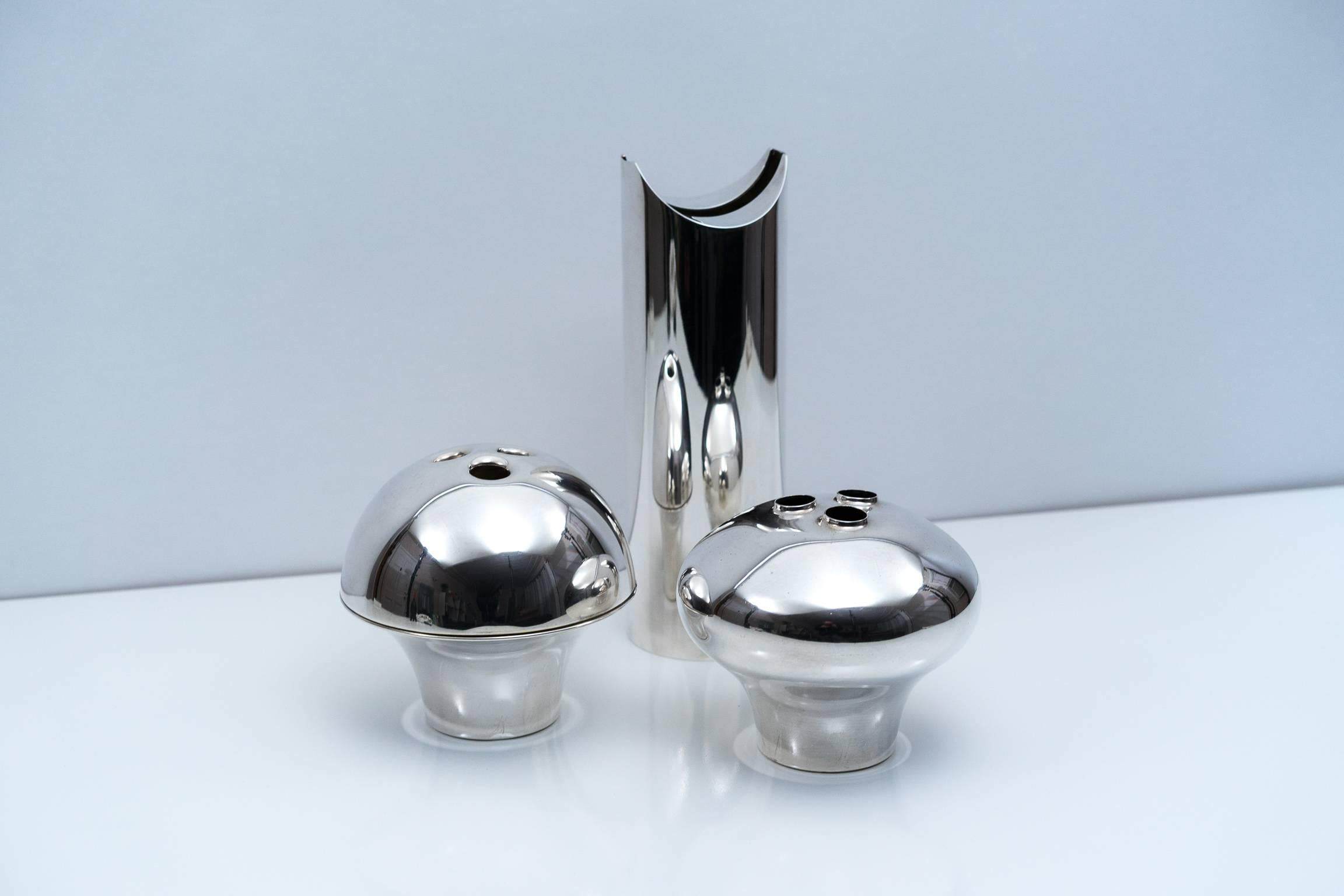 Stunning grouping of three silver plated pieces designed by Lino Sabattini for his eponymous firm. The tallest vase, 