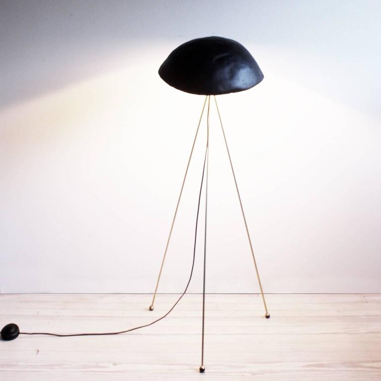 Funny Buddy Floor Lamp with Concrete Noggin and Brass Tripod Legs For