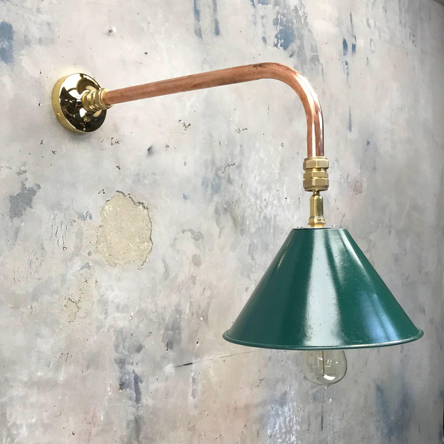 A reclaimed army green color shade reclaimed from the British army where they where used as festoon shades in there hundreds.

Loomlight have fabricated a copper and brass cantilever wall mount where the shade can be tilted at any angle for