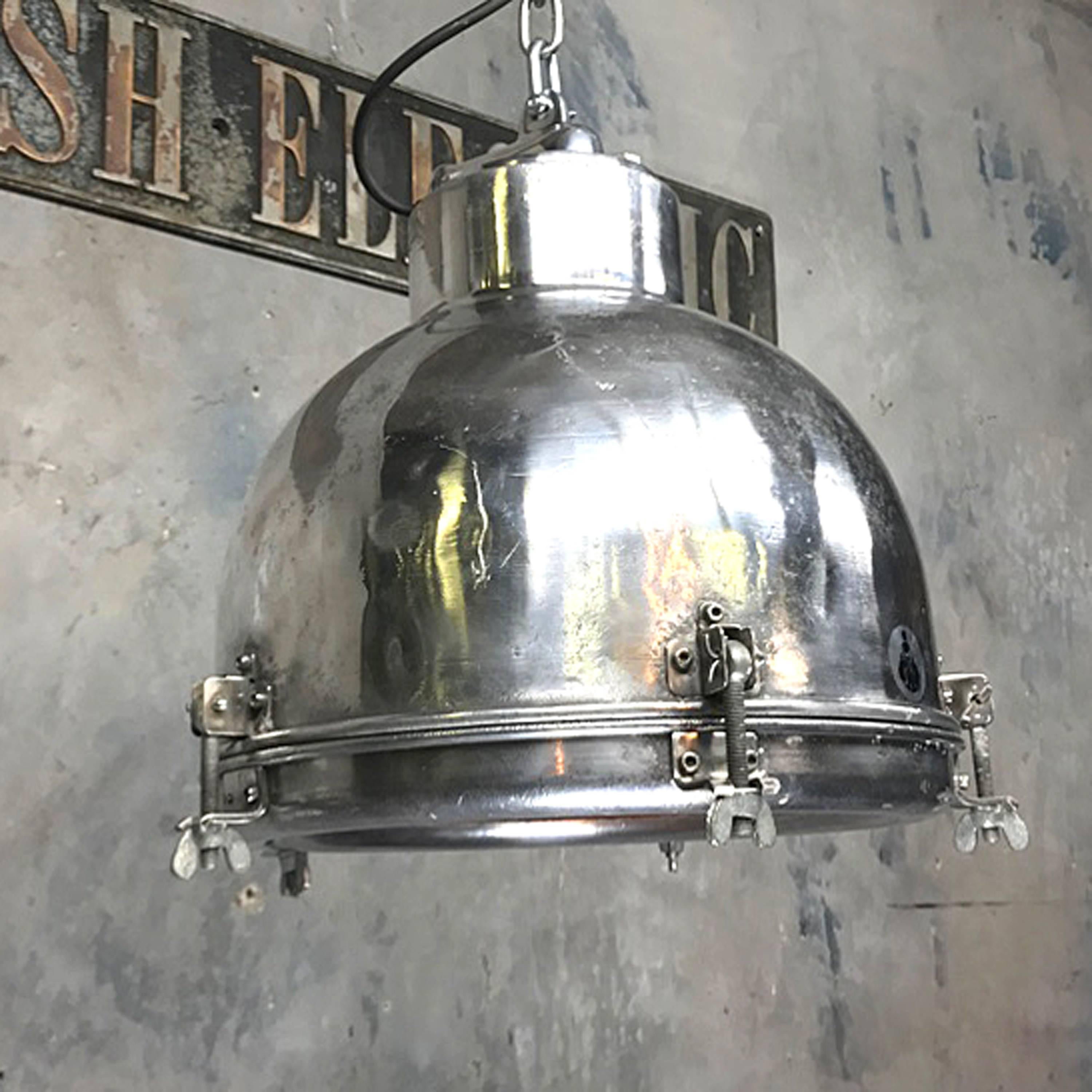 Polished aluminium dome pendant with toughened glass lens.

Originally used on super tankers and cargo ships built during the 1970s.

This has been retro-fitted with a domestic BC bulb holder (ES bulb holder can be fitted on request)

Inside the