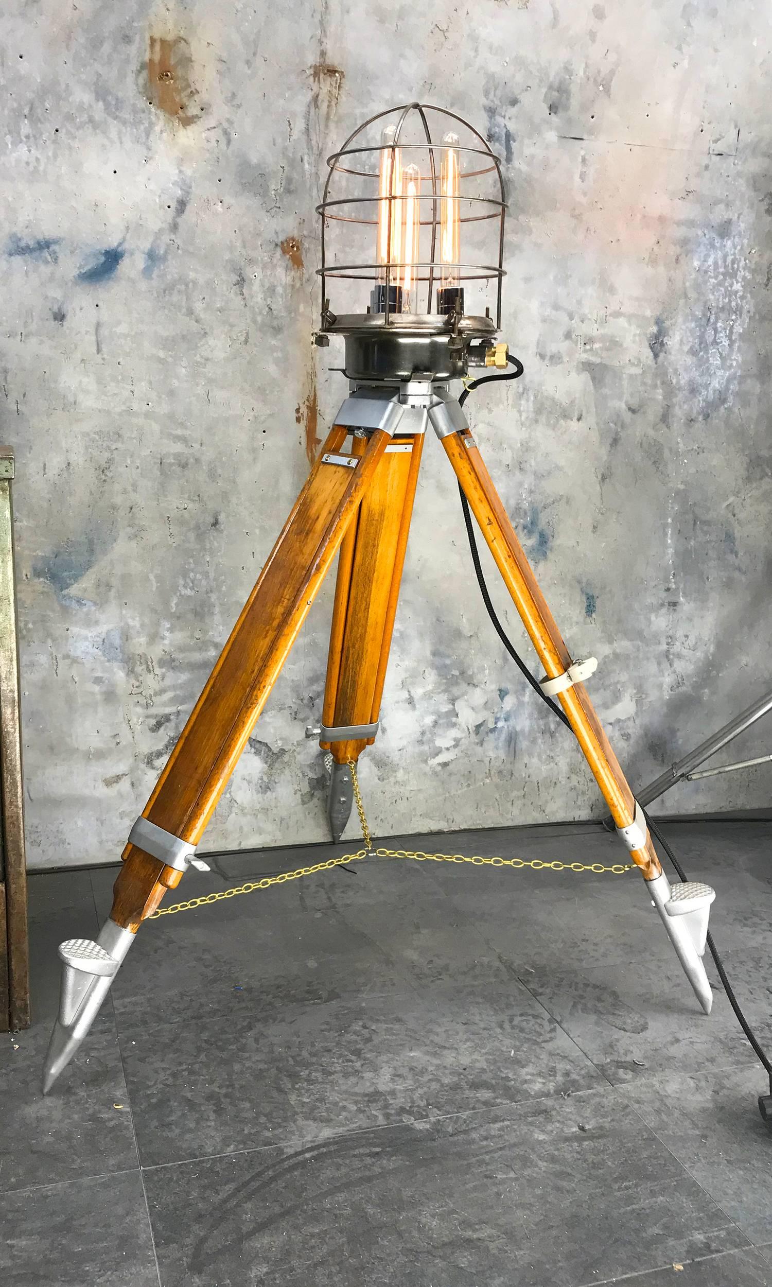 Unique Steampunk style tripod lamp with four Edison filament bulbs.

The head is a mild steel lamp casing reclaimed from a Russian cargo ship.

Here at loomlight we have removed all the original electrics and four chromed E27 lamp holders with