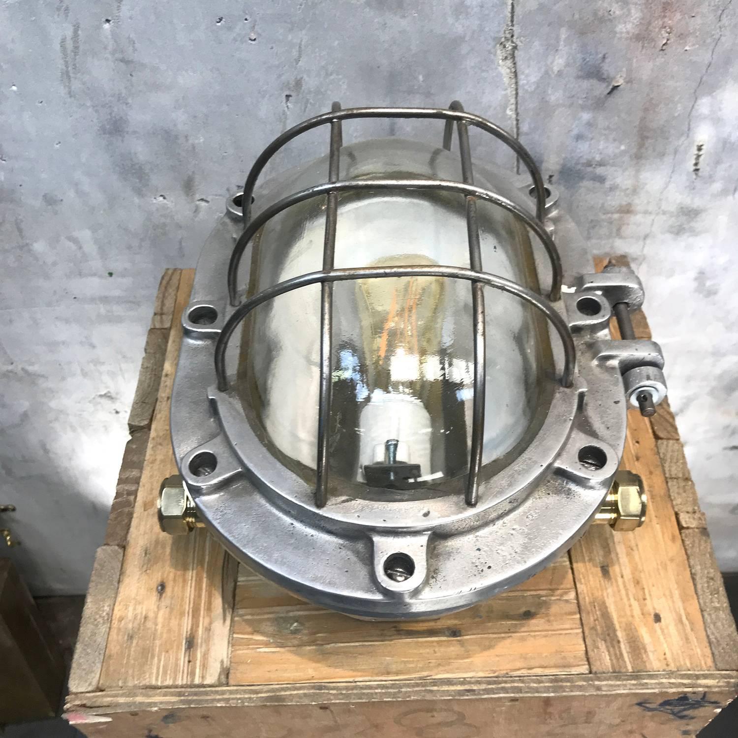 Extra large and extremely robust aluminium bulkhead lights reclaimed from super tankers built during the 1970s.

Built to last in the most harsh conditions and also suitable for use outdoors.

The main body is cast aluminium with tempered glass