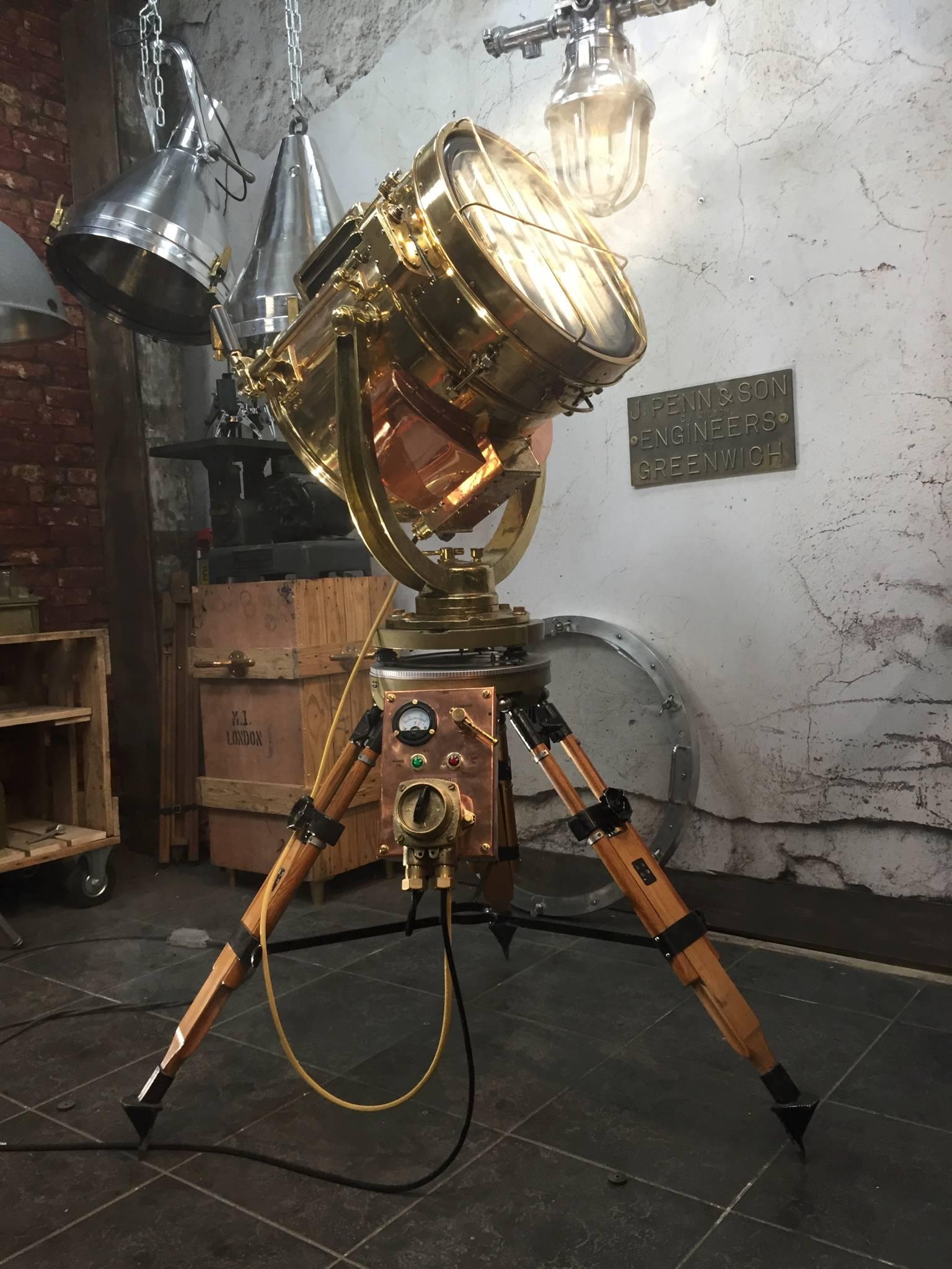 This is a Shonan Kosakusho daylight signalling lamp made in 1981, married with a Russian military gyroscope tripod. 

Reclaimed from Mid-Century war ships, Shonan did manufacture these during World War 2 until the firestorm on Japan ceased