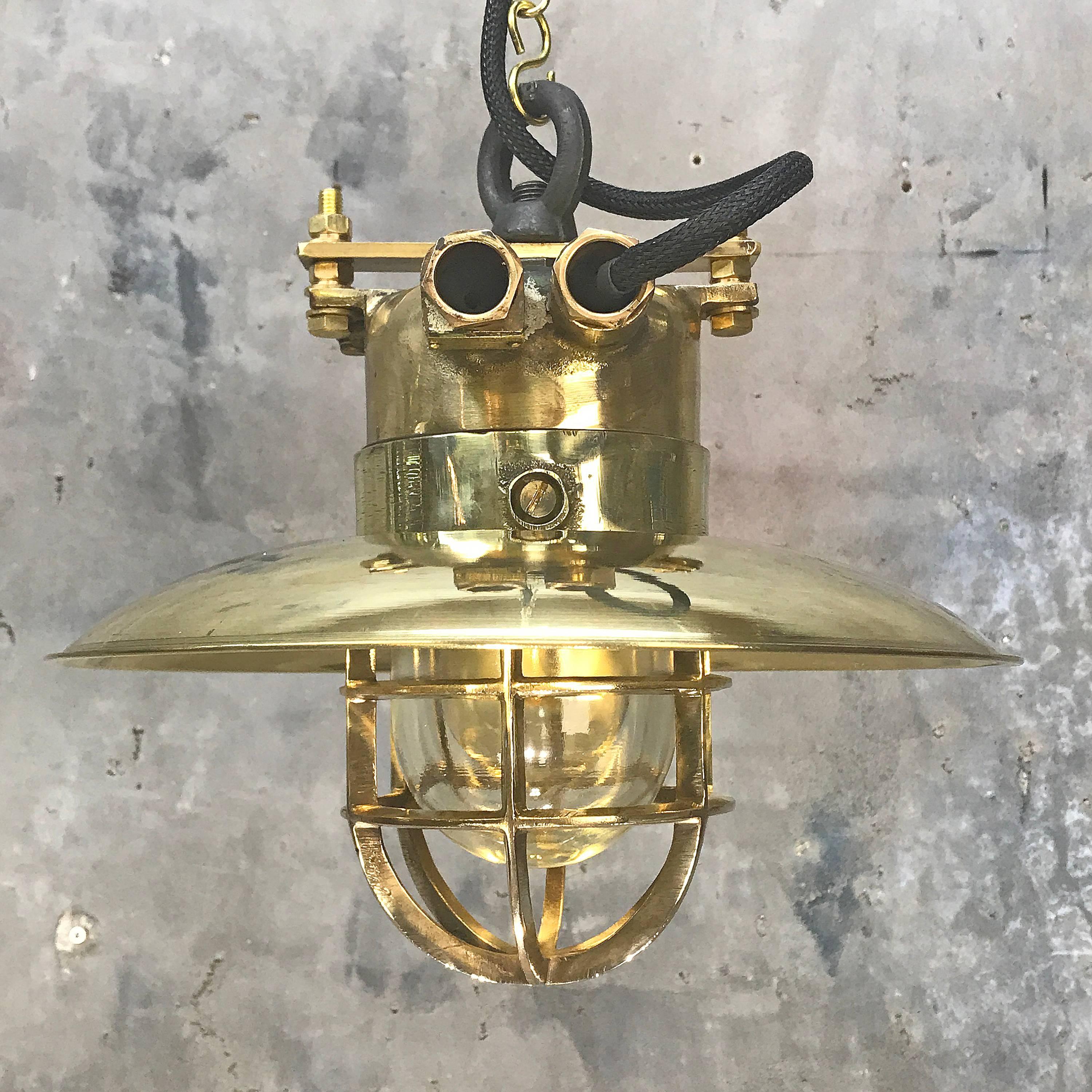 Solid cast bronze and brass explosion proof pendant with 30 cm copper shade E27.

This is an excellent example of an original explosion proof lamp which was salvaged from an old German ship. The date is circa 1975, it has the original ceramic and
