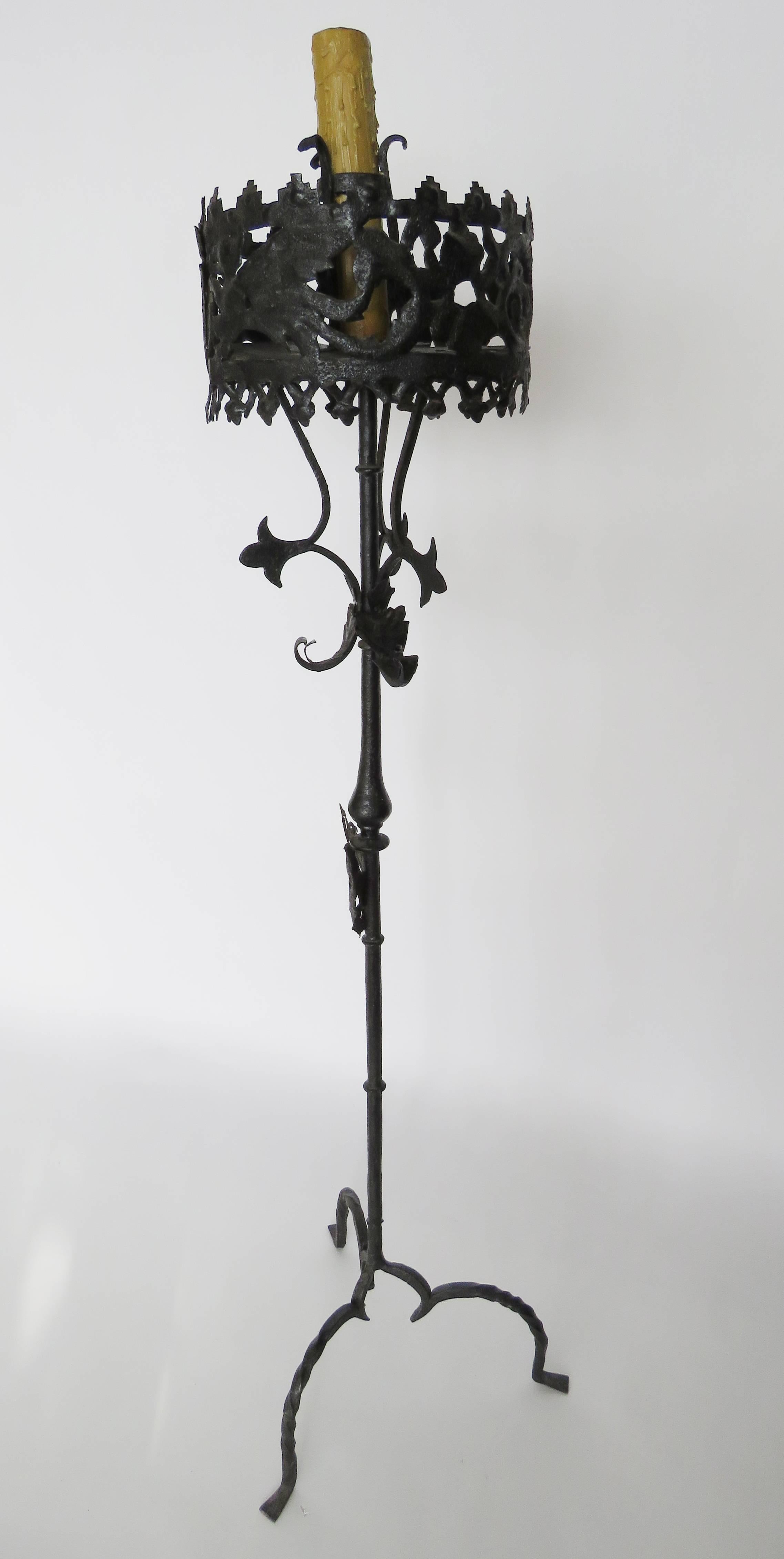 Large elaborately decorated platform on a rod standard with foliage detail supported on twisted arched tripod. Wood candle with bee wax finish. Measurement: height is to the candle top.