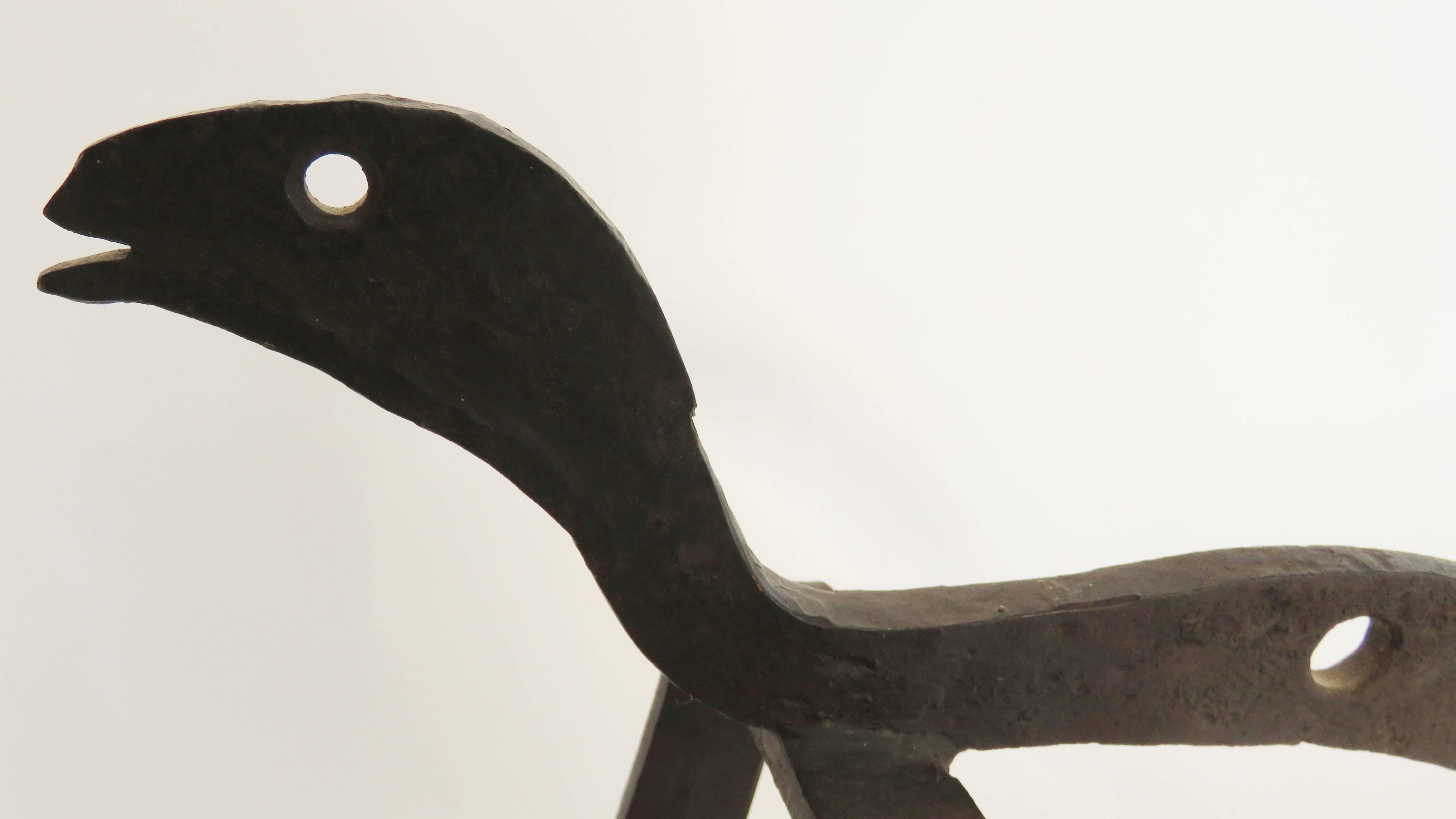 Modern, 20th century forge iron lizard or dog andiron.
