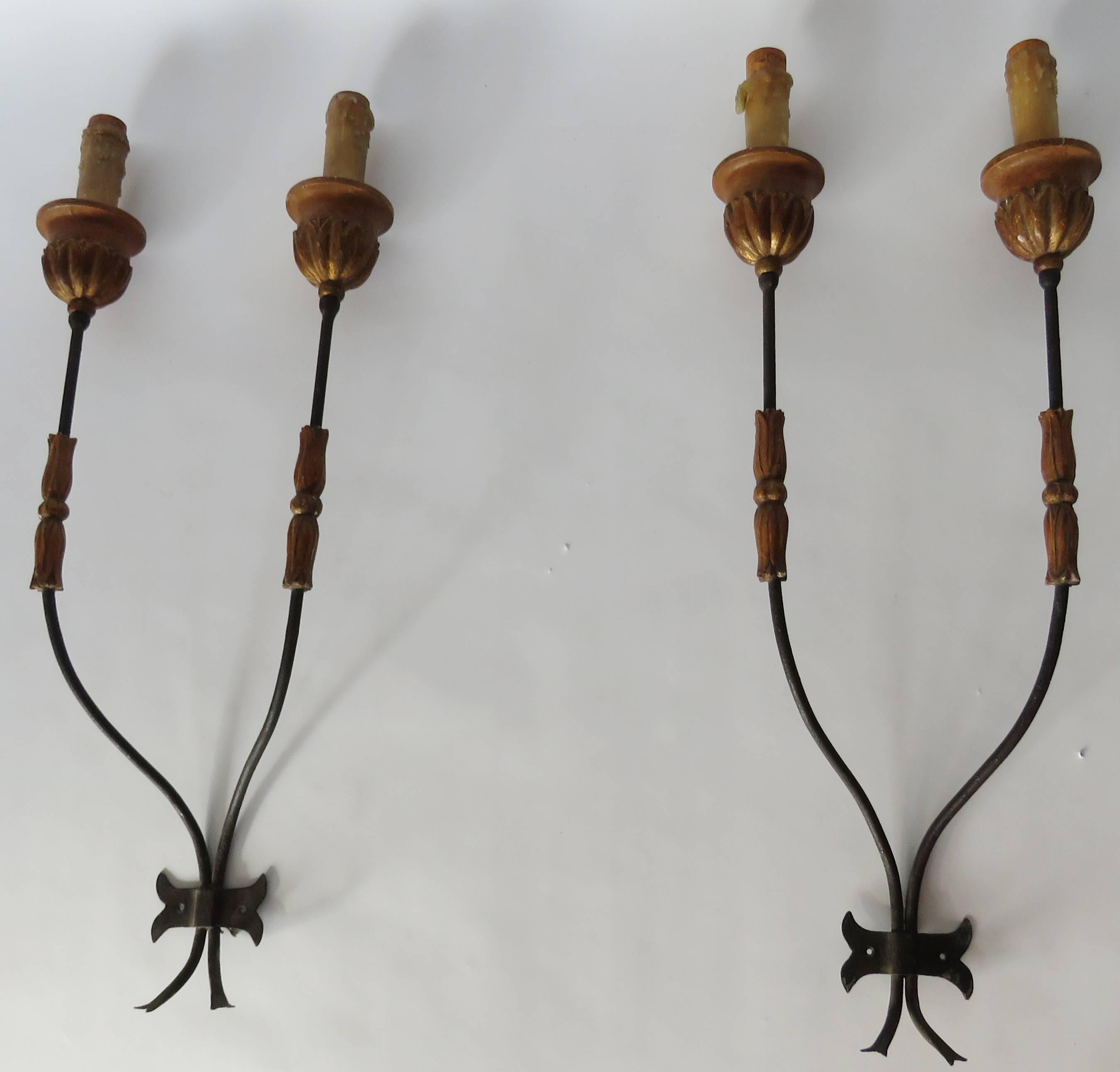 Pair of large candelabra applique sconces, made in hollow iron and paintwood.
