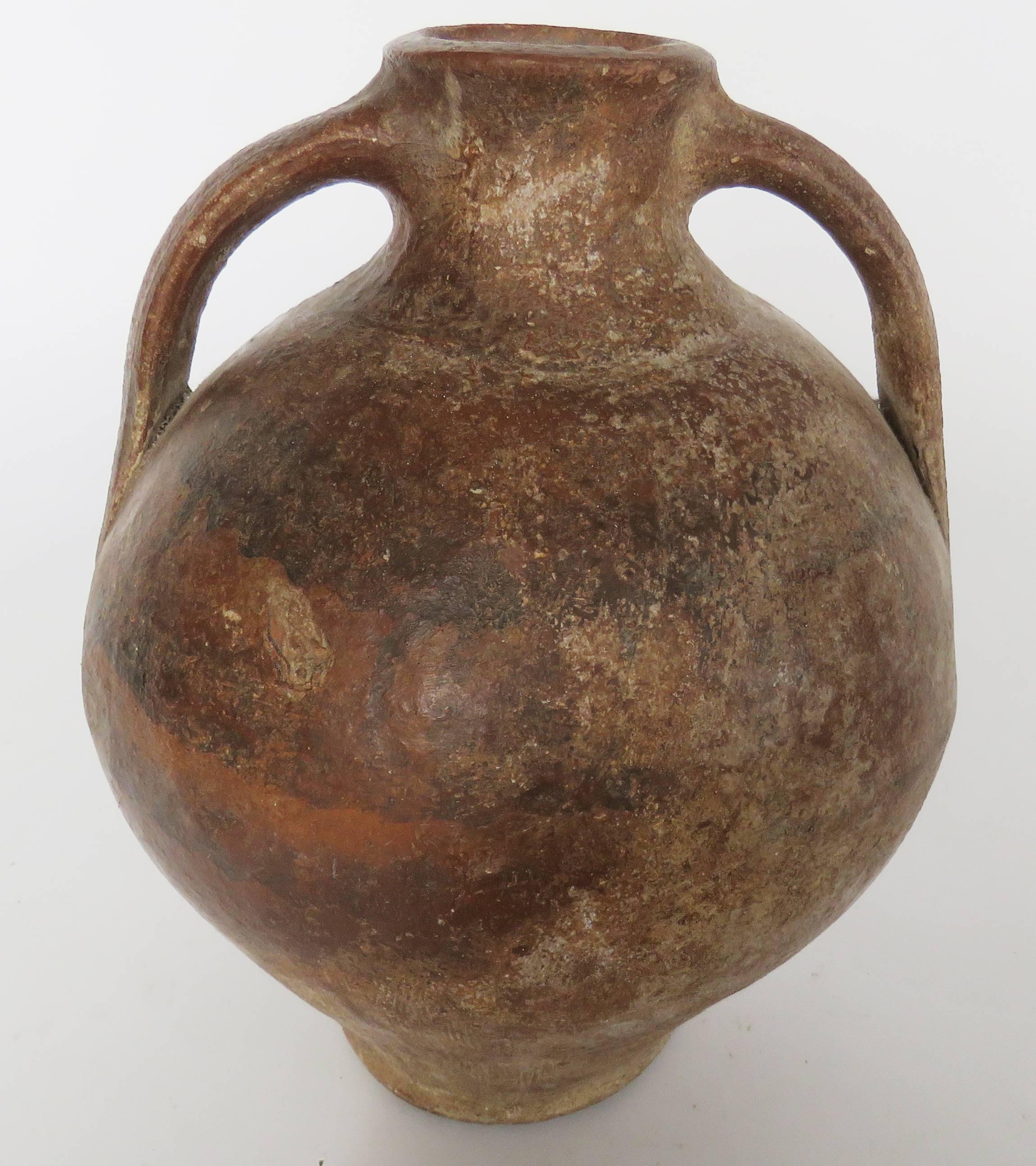 From left to right:
Primitive Calanda terracota pot (Spain), size inches: 12.5 high x 9 diameter
Hand coiled glazed storage pot with rope design and two handles (Spain), size inches:10.75 high x 12.5 diameter
Terracota pot with yellow naïf art