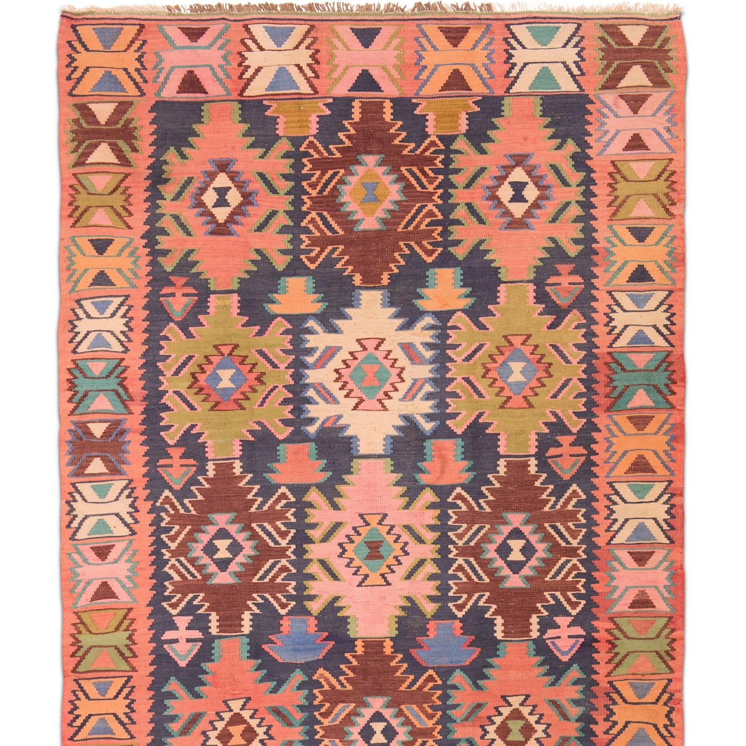 This antique Avar Kilim was woven in the Dagestan area of the east Caucasus in the early 20th century, circa 1920. Woven in an array of exceptionally colored wools the design is sometimes referred to as the 'racing car' pattern.