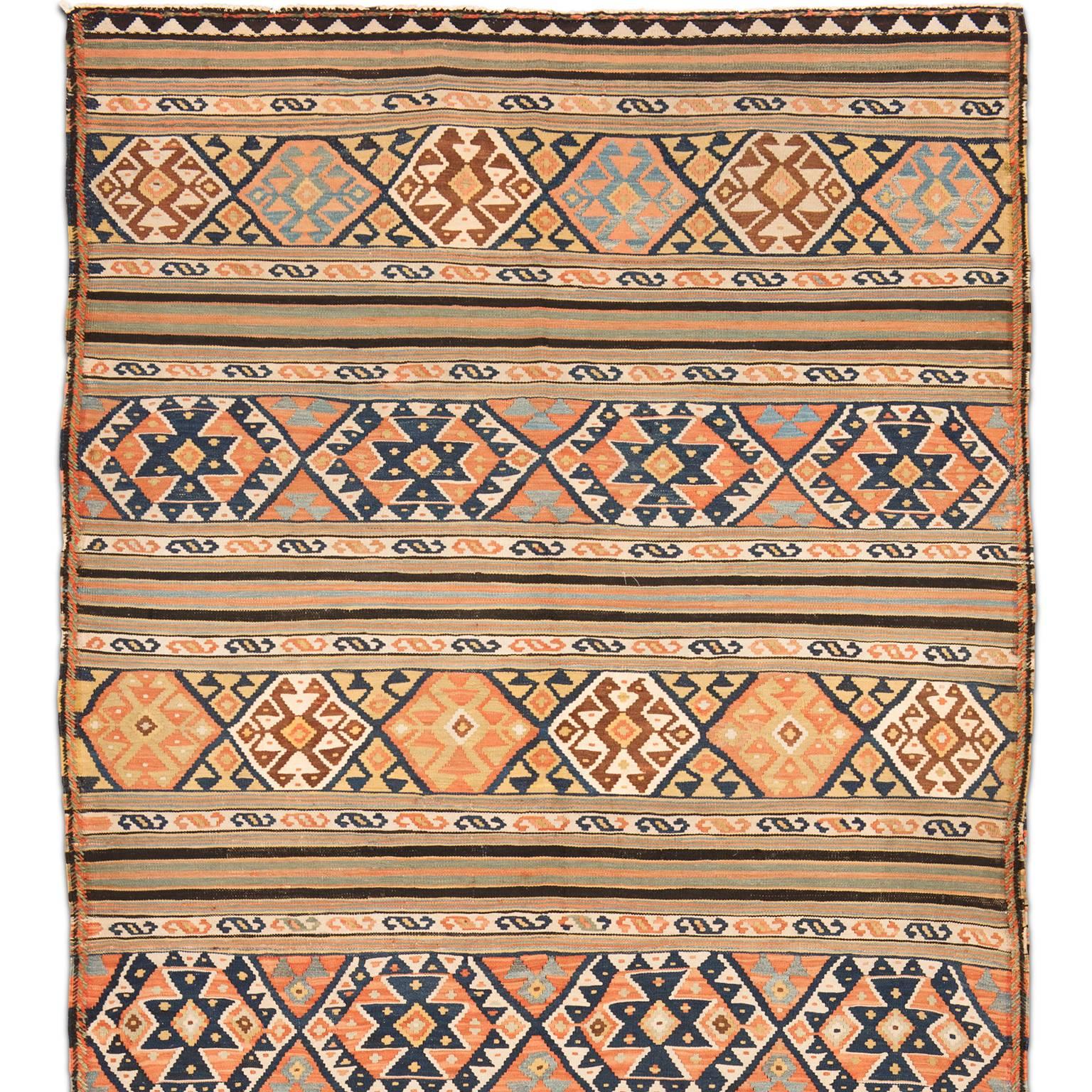 Antique Caucasian Kilim from the Azerbaijan area. Dates from the early 20th century, circa 1920. This finely woven Kilim has a dynamic banded design of repeated diamonds and triangles.