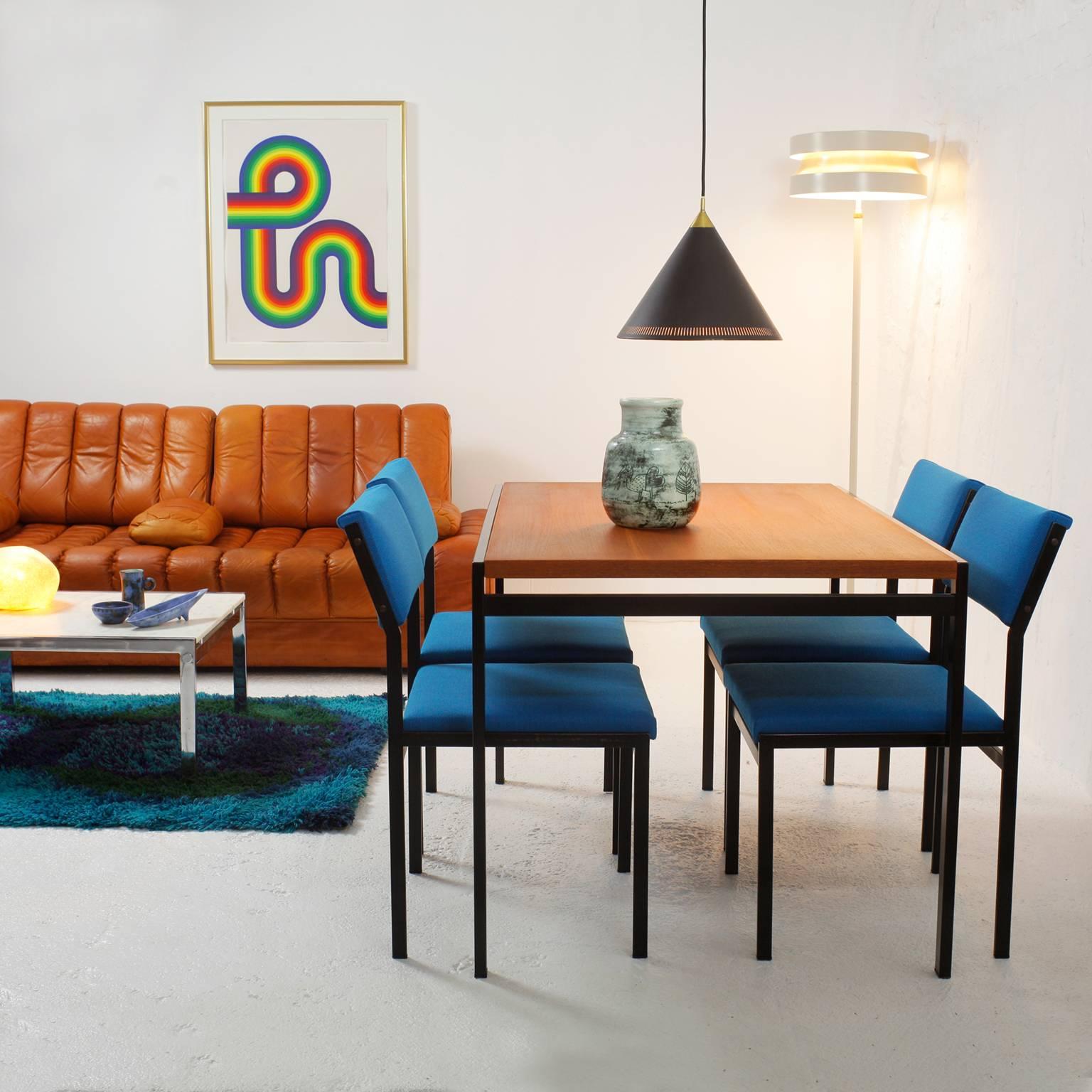 Set of four Cees Braakman Japanese serie dining chairs for Pastoe.
New bright blue Kvadrat upholstery.
Enameled black metal frames in original condition with some wear consistent with age and use.
Stamp Pastoe on each chair.
