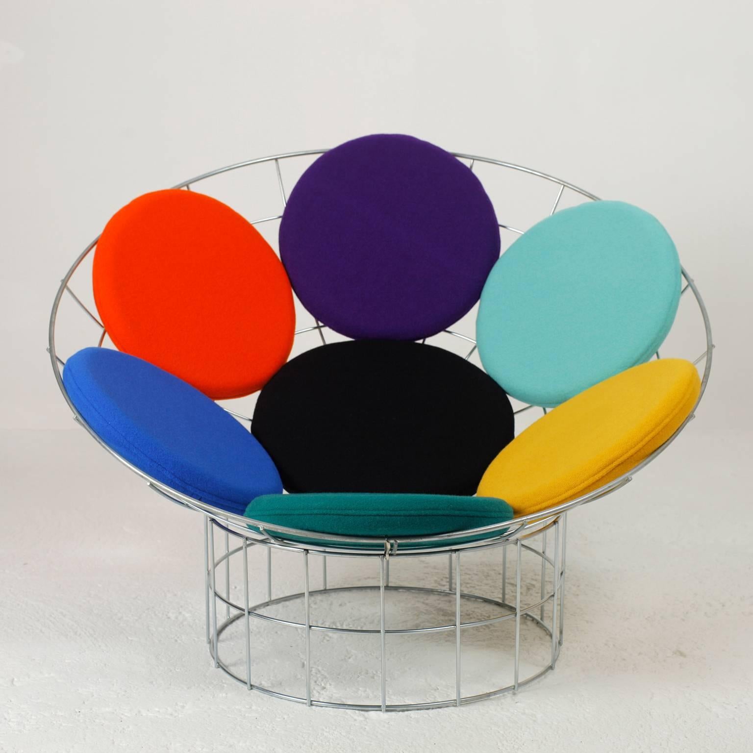 Iconic peacock chair by Verner Panton.
Very pop lounge chair.
Collection piece.
This reissue from Habitat dates from 1980s, they were reissued in limited numbers and discontinued in less than a year. No more manufactured today.
The cushions are