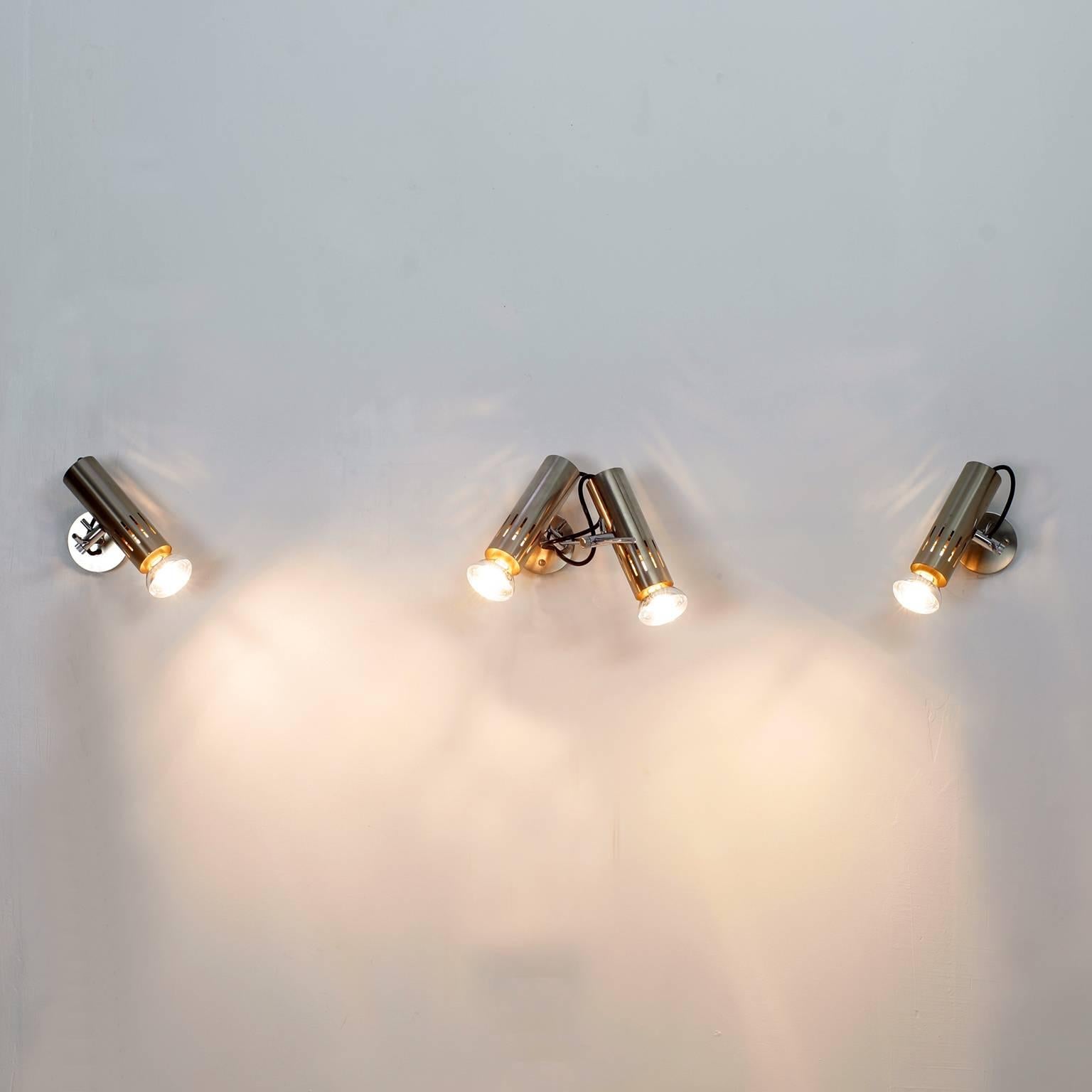 Set of three Alain Richard sconces for Disderot 1960s. Brushed metal adjustable spots on a chrome-plated steel rod.
One double wall lamp and two simple wall lamps.