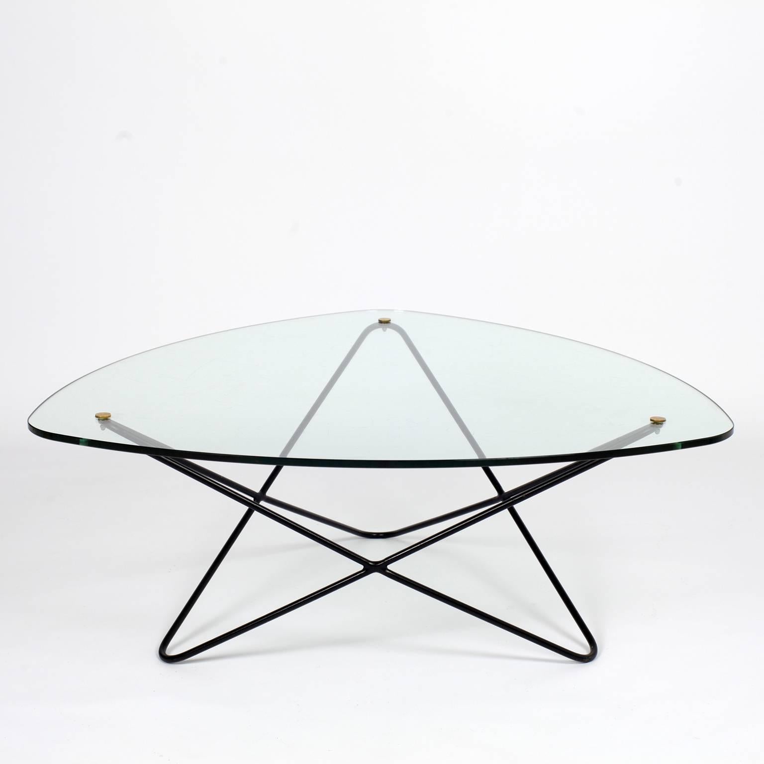 Delicate and airy coffee table named Jasmin designed by Florent Lasbleiz for Airbone, circa 1952.
Glass top and blak enameled steel structure with brass details.
Very good condition with tiny scratches on the glass top.