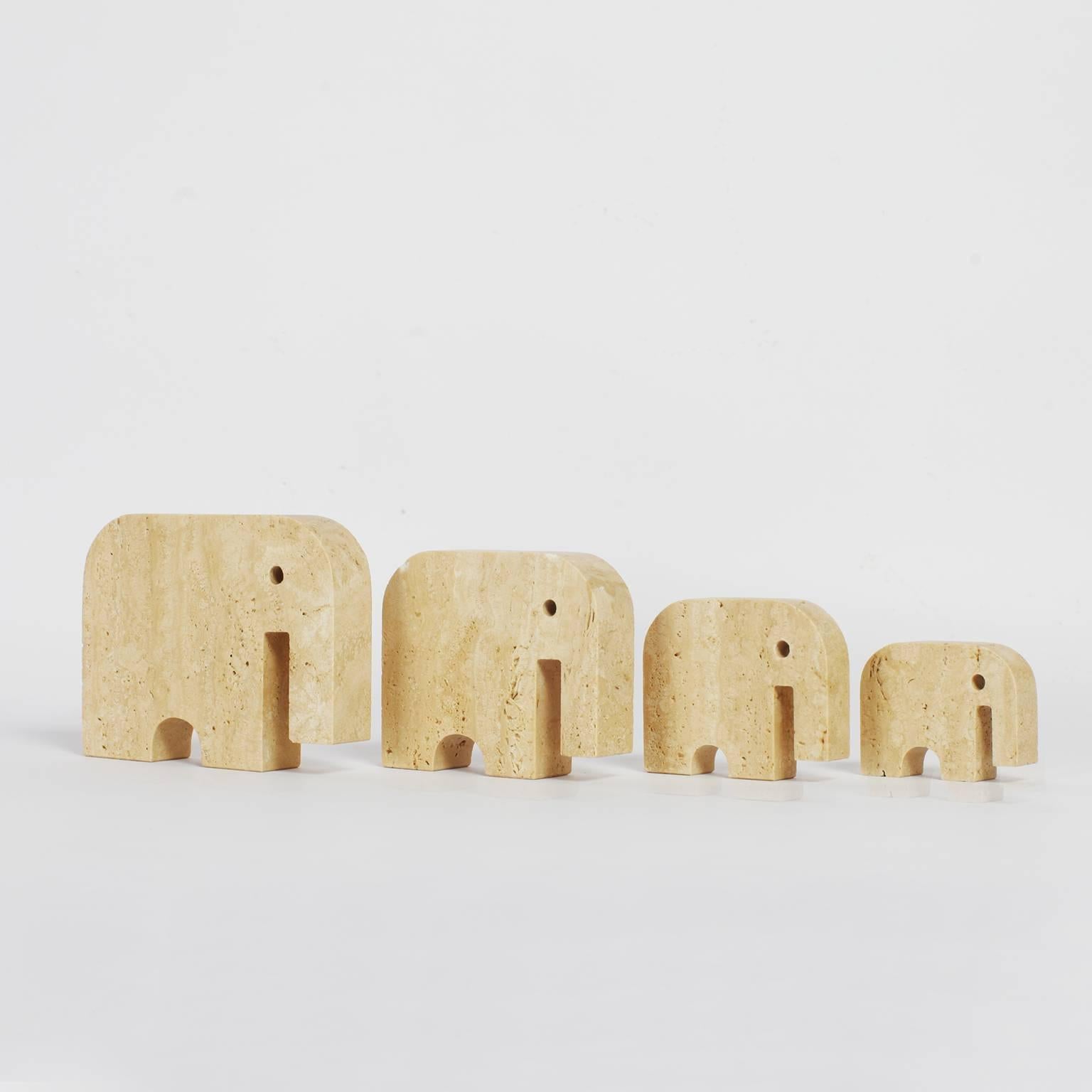 Four in ascending sizes, stylized elephants made in travertine,
designed by Fratelli Mannelli Italy in the 1970s.

Dimensions: Largest 11.5 x 15 x 3 cm (HxWxD) 
Second largest 10 x 12 x 3 cm (HxWxD) 
Third largest 8 x 10 x 2 cm (HxWxD)
