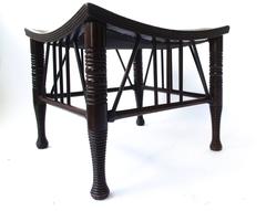 Liberty & Co A Large Size Walnut Thebes Stool with ring turned legs & stretchers