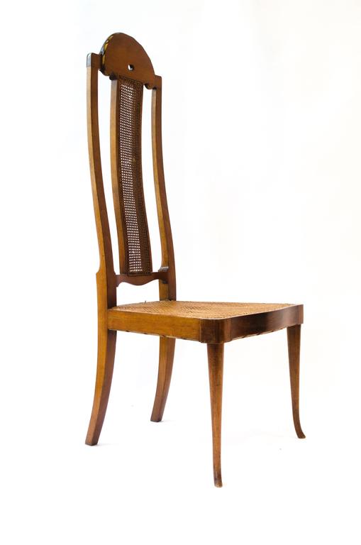 George Walton. A Rare Arts & Crafts walnut high back 'Philippines begere chair'. 
The serpentine shaped high back is not just very comfortably but very elegant and refined. 
In the Philippine drawing room interior from Brasted in Kent a commission