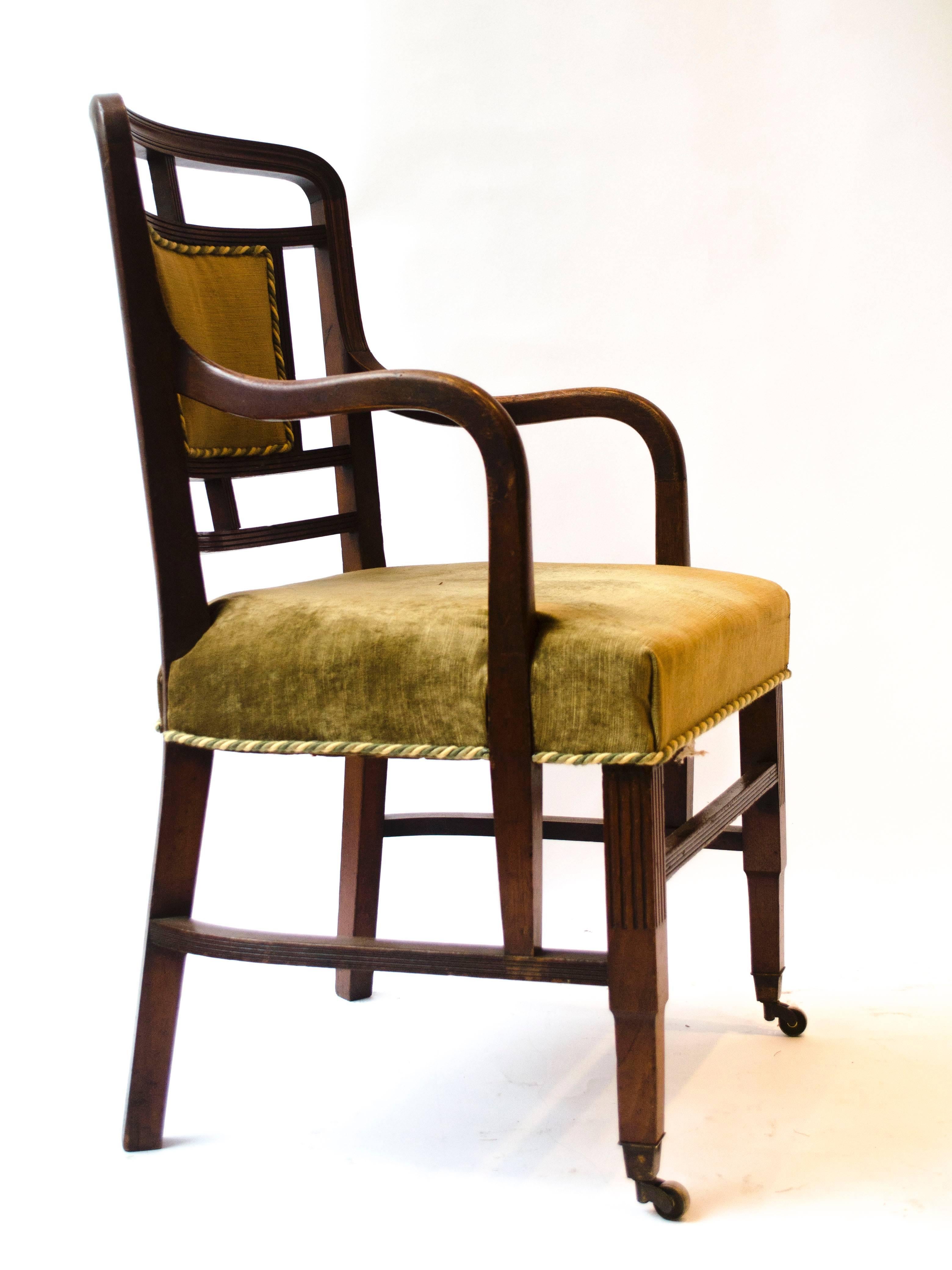 Edward William Godwin (1833-1886) for William Watt, an extremely rare Anglo-Japanese armchair, with a pad centred open curved back, downswept arms and professionally re-upholstered.
The design for this armchair was illustrated in William Watts Art