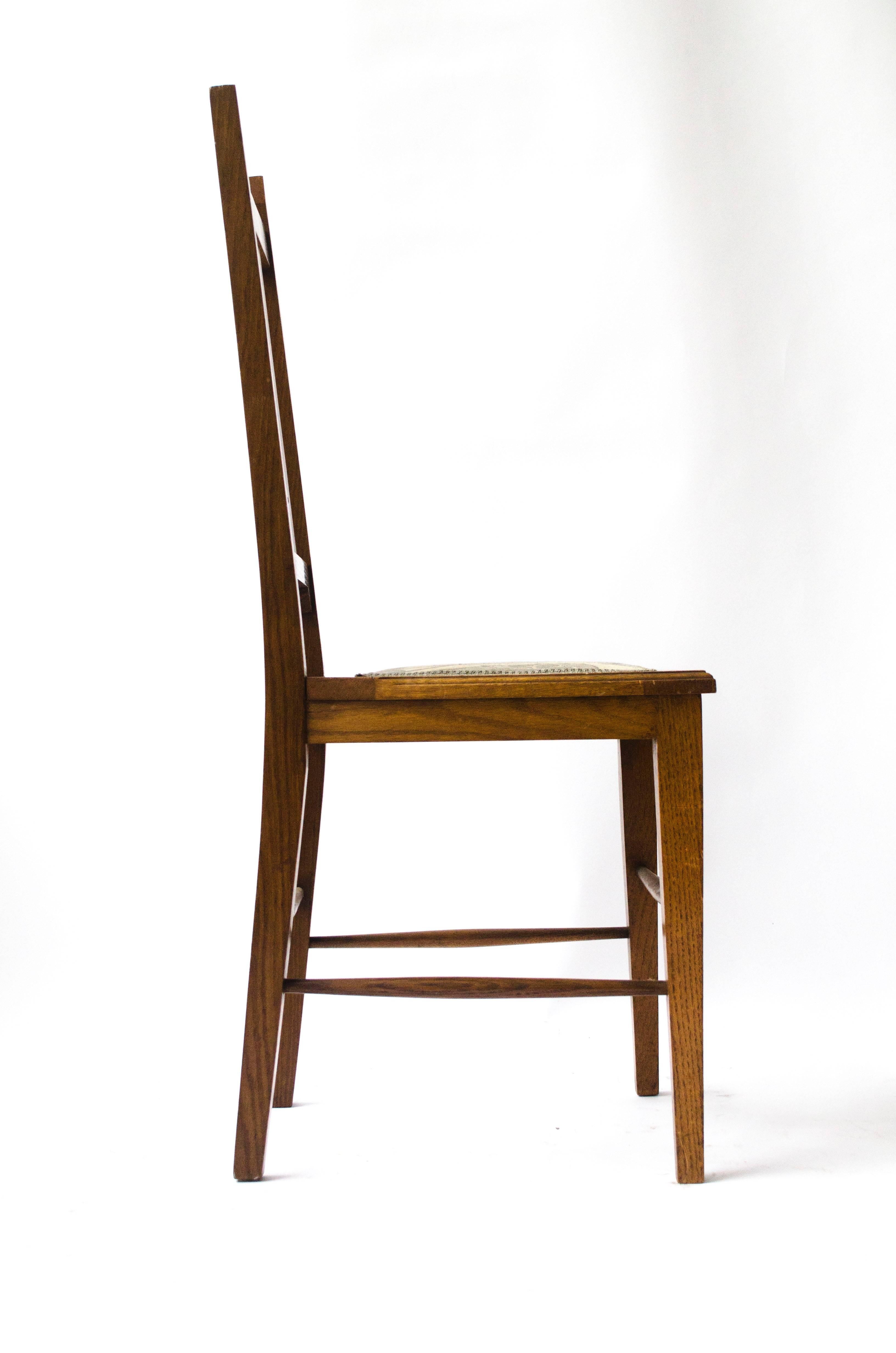 E A Taylor attri, made by Wylie and Lochhead.
An Arts and Crafts Scottish School oak chair attributed to with stylised cut-out to the back and a wonderful Arts and Crafts floral upholstery.