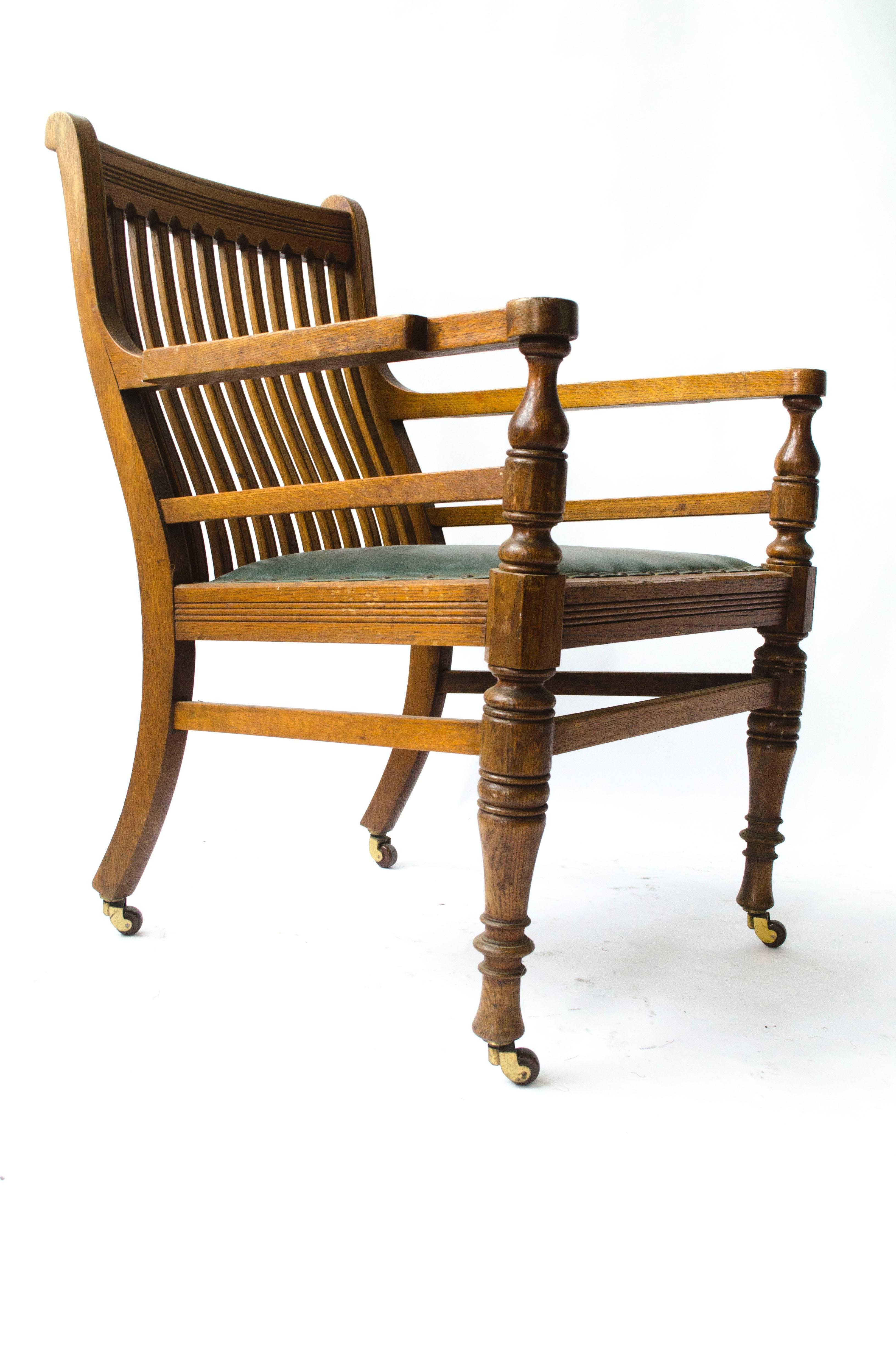 Attributed to E W Godwin; 
An Aesthetic Movement oak armchair made by James Peddle. 
With shaped arms, turned front legs and saber back legs united by high stretchers.
A comfortable and light armchair.
Professionally re upholstered in a quality