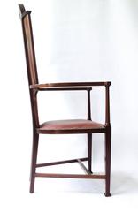 J S Henry attr. An Arts & Crafts Mahogany Armchair With Stylised Floral Inlays