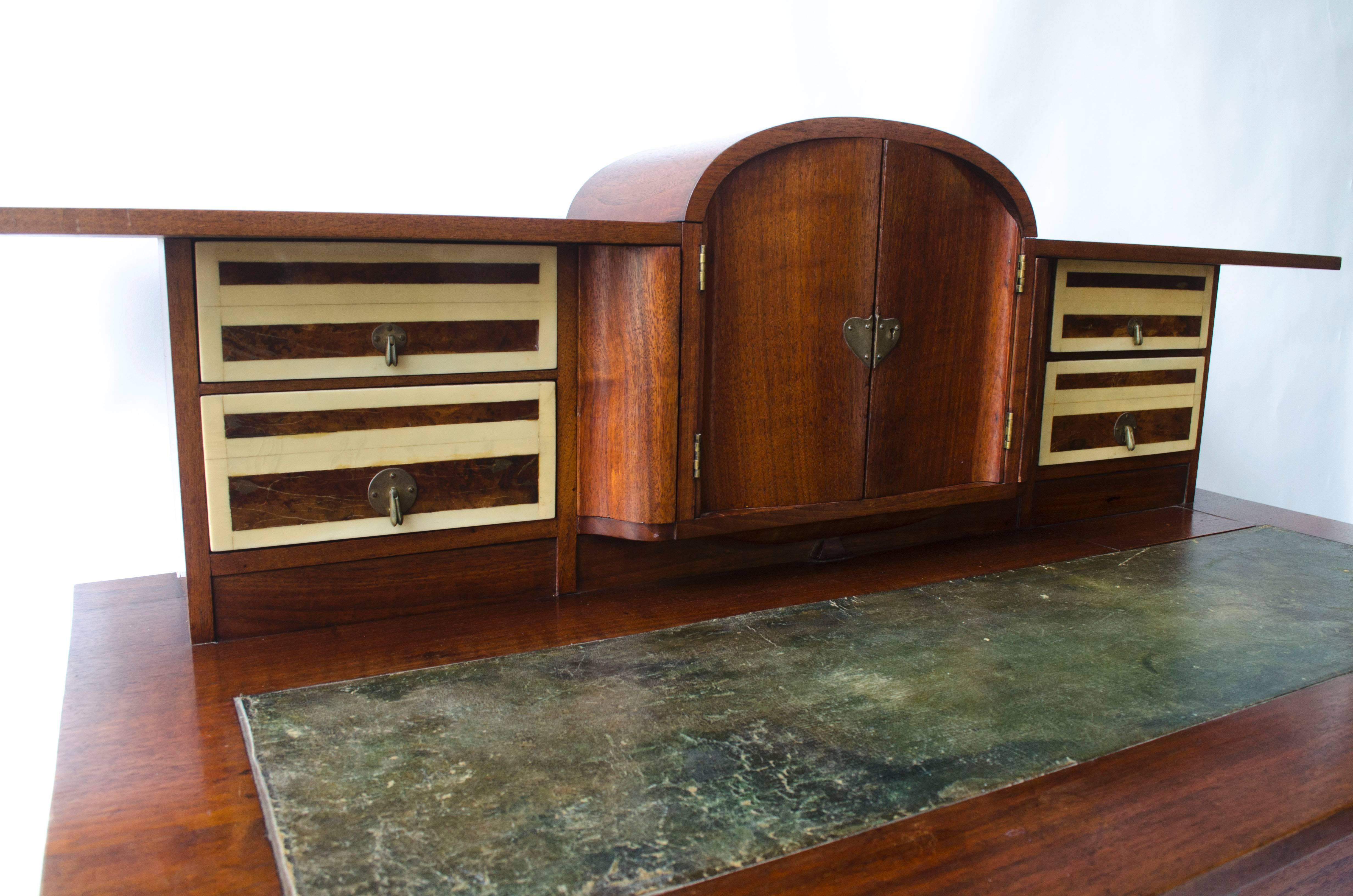 George Walton. A rare Arts and Crafts walnut desk almost identical to the desk Walton designed in 1898 for Sidney Leetham for the morning room in Elm Bank, a major interior commission in York, England.
This desk is a complex hybrid design. The