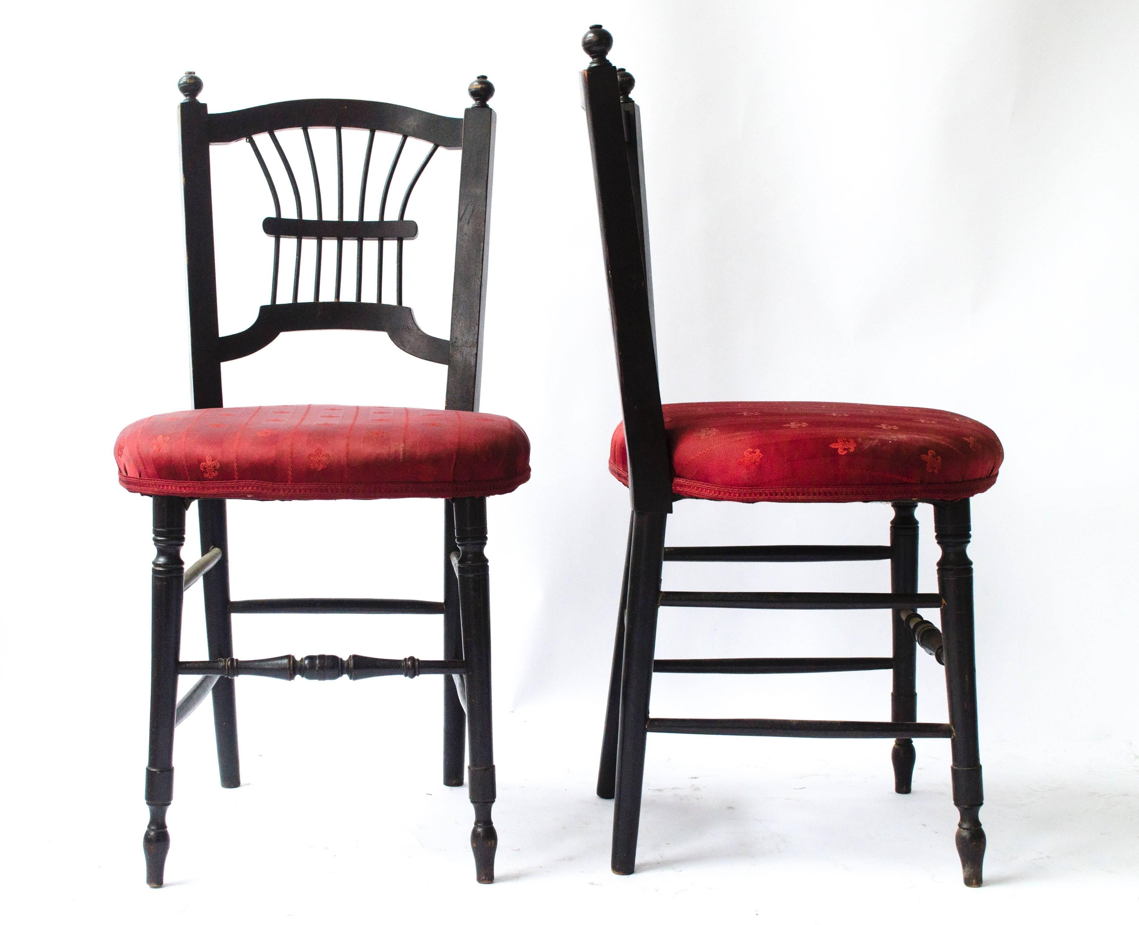 Morris and Co 
A pair of Aesthetic Movement ebonised side chairs from the Sussex range designed by Dante Gabriel Rossetti with fine fan back spindles and turned legs, originally had rush seats now upholstered.
We can have new rush seats laid if