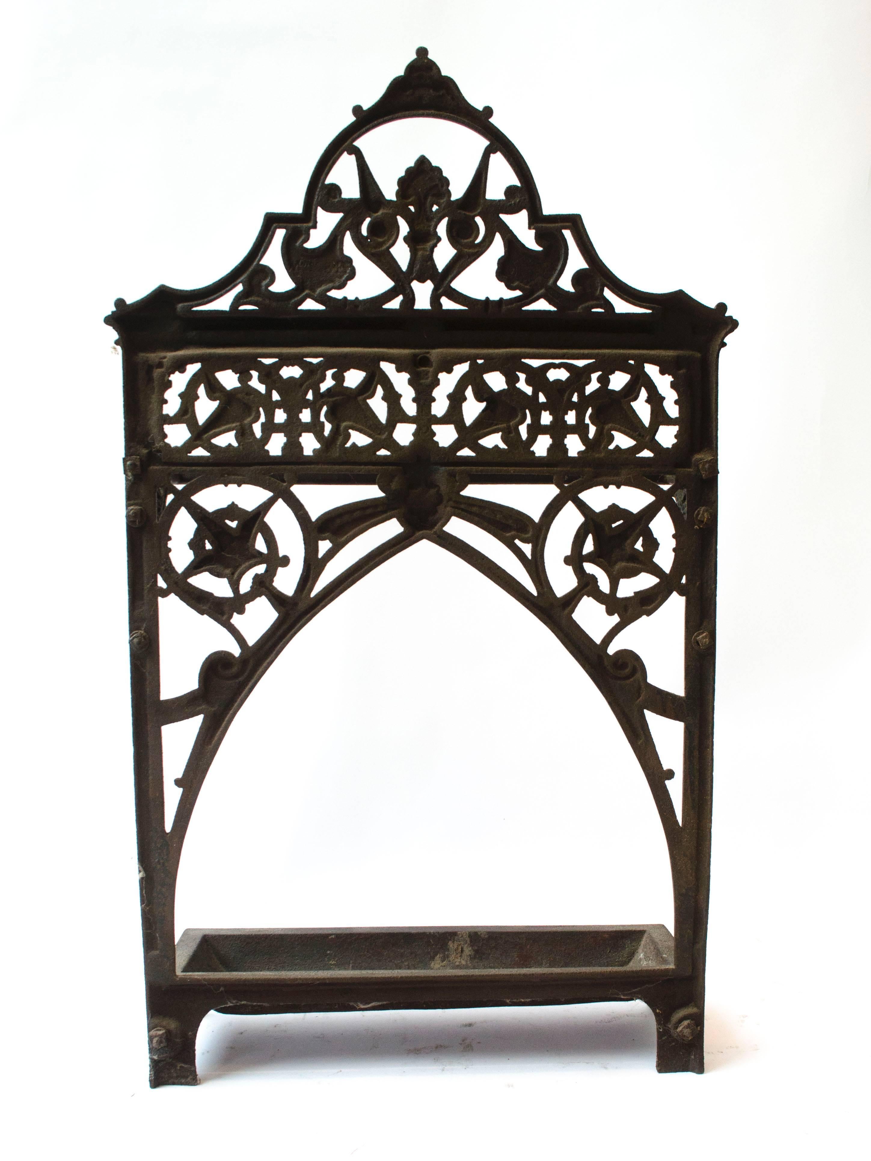 Dr C Dresser An Aesthetic Movement Cast Iron Stick Stand with stylised floral details. 
Made By Coalbrookdale Iron Works.
(The width is measured to the edges of the little lions paw feet).
