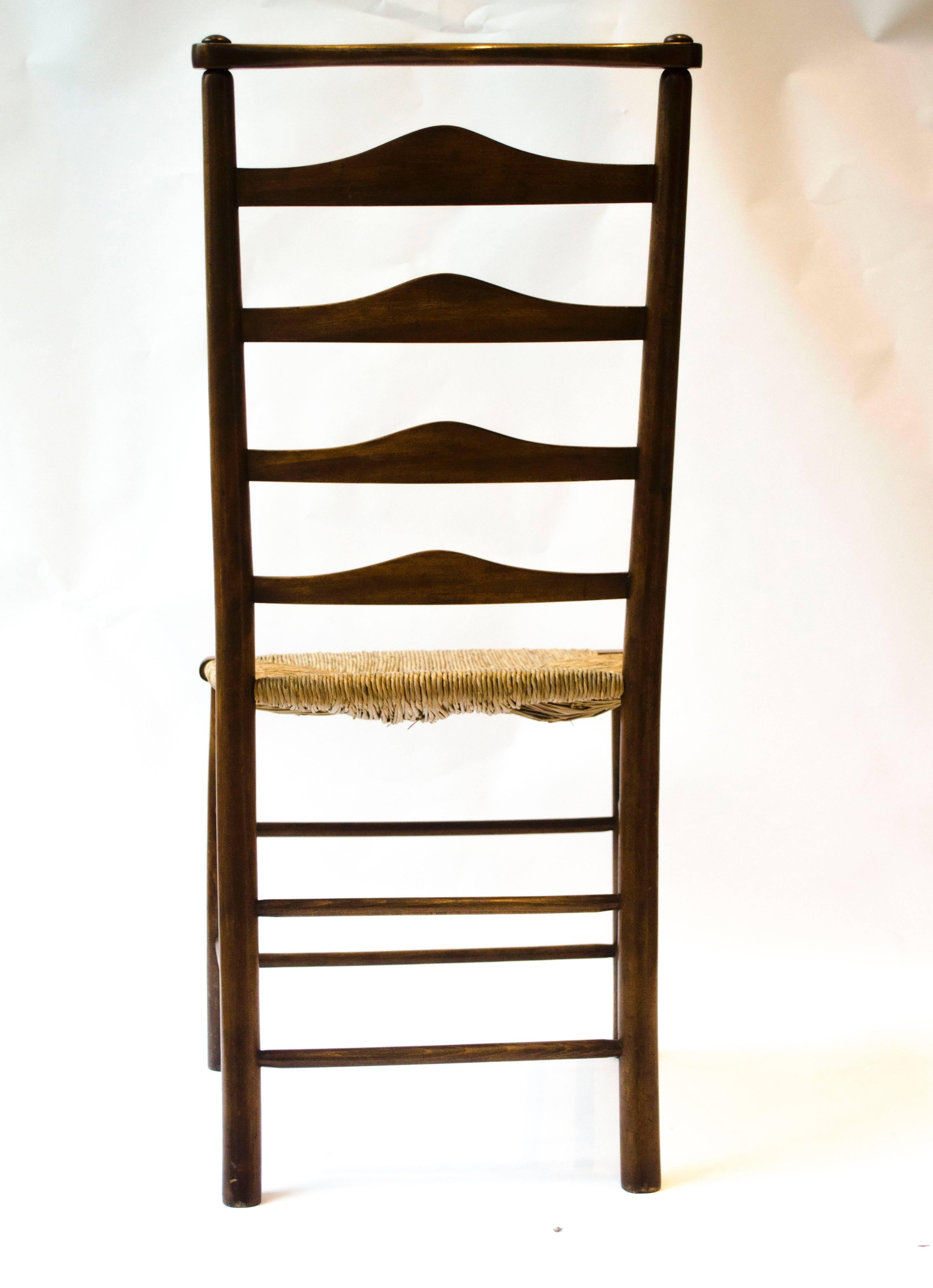 English C R Ashbee Made By The Guild of Handicraft A Ladder Back Armchair and Side Chair