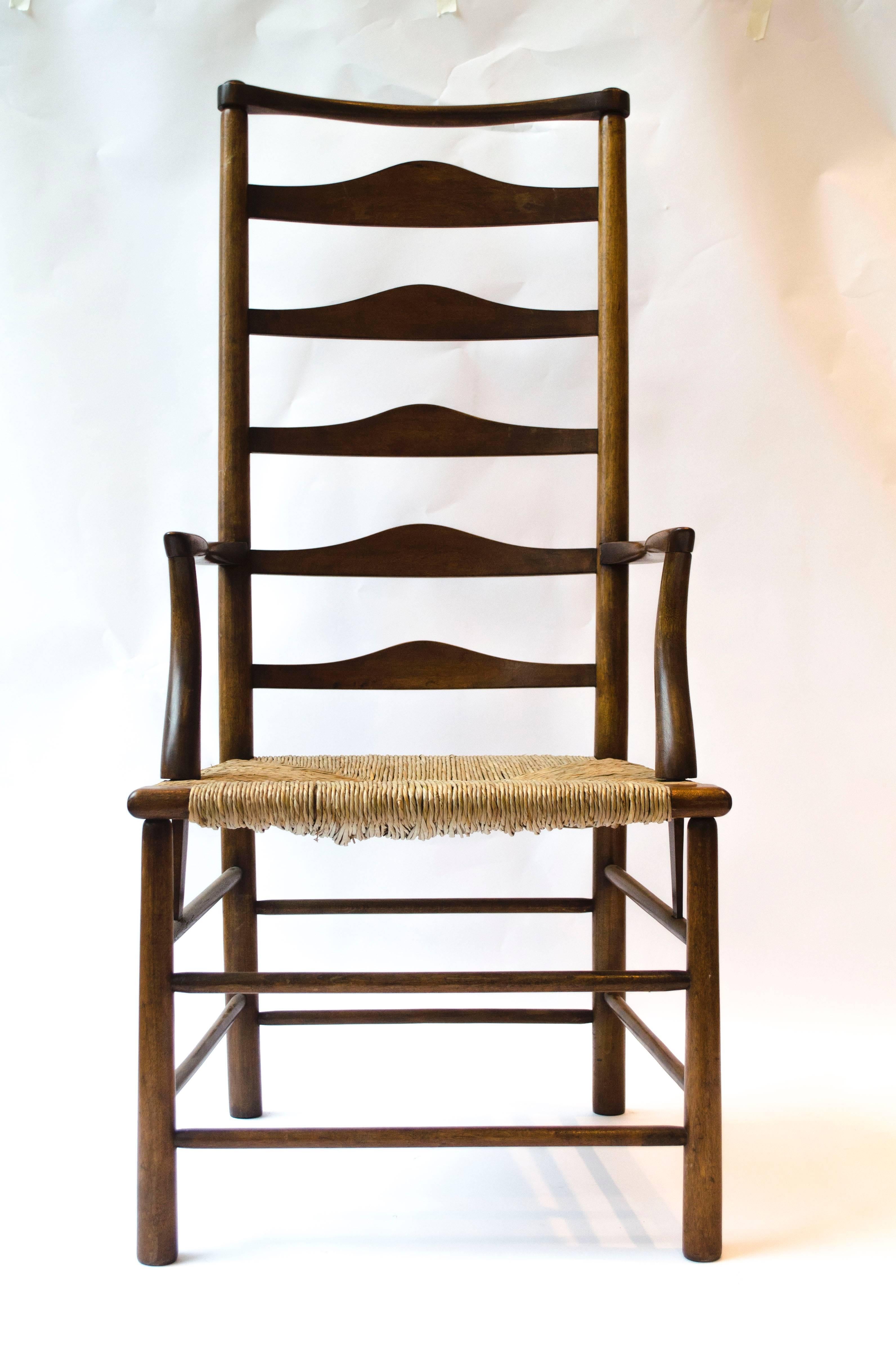 Charles Robert Ashbee (1863-1942) made by the guild of handicraft.
A stained beech high back ladder back armchair and a single matching side chair. 
Designed for the dining room of the 'Magpie and Stump', Cheyne Walk, Chelsea, his family home from