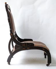 Richard Charles An Aesthetic Movement Ebonized and Parcel Gilt Lounge Chair.