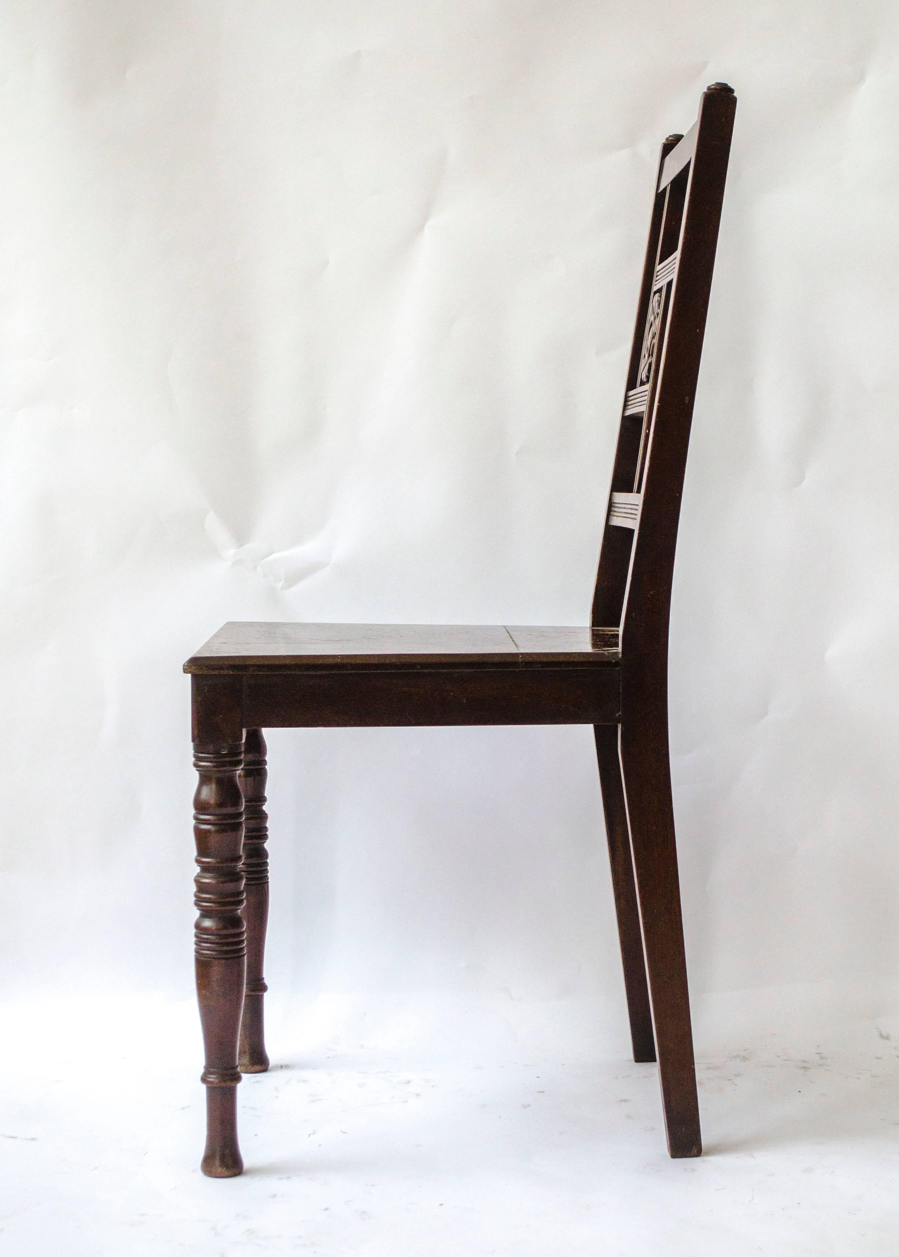 Attributed to Bruce Talbert and probably made by Gillows of Lancaster.
Anglo-Japanese walnut side or hall chair with carved sunflower to the back on ring turned legs 