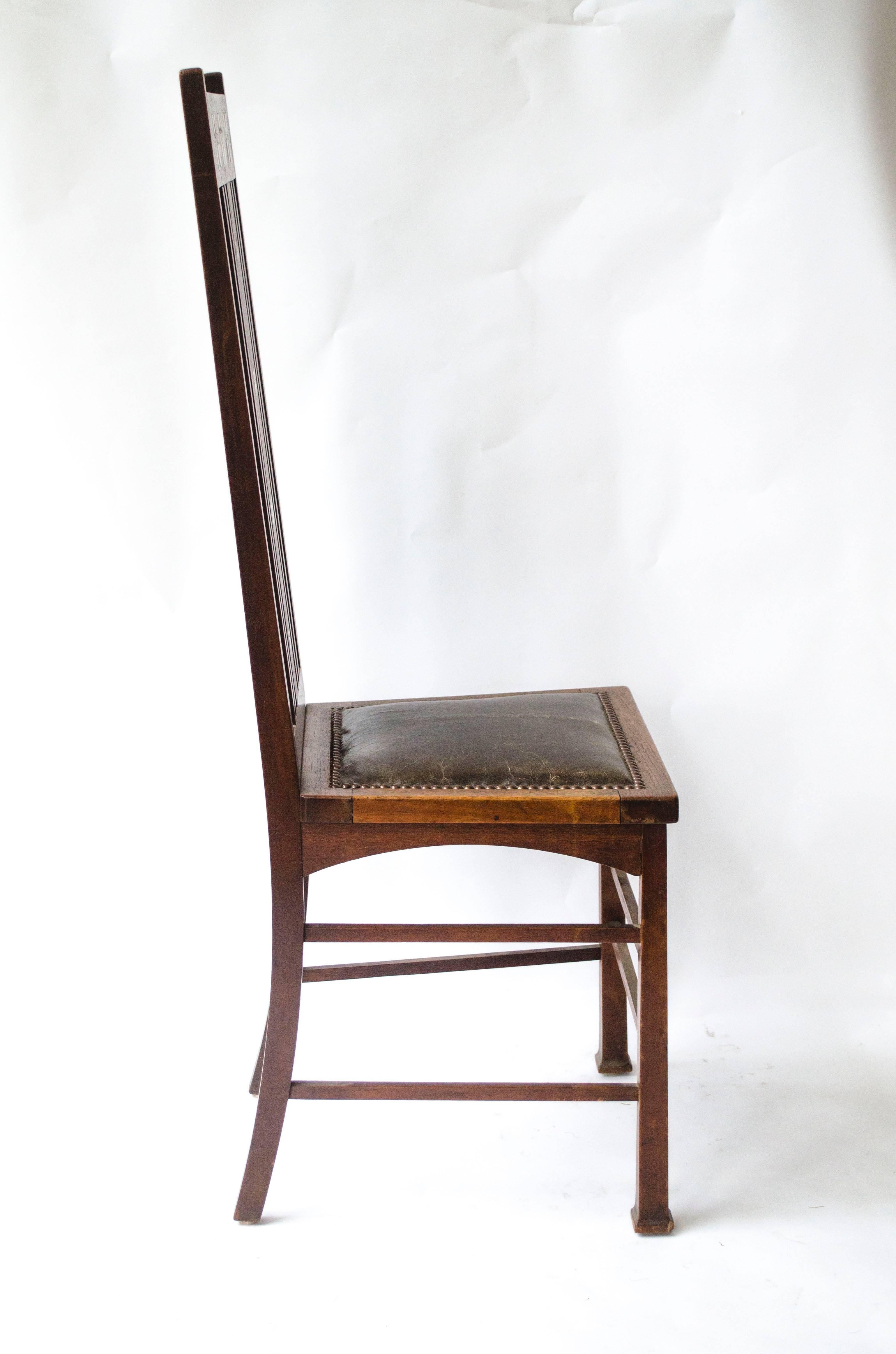 The butterfly chair designed by E. A. Taylor and made by Wylie and Lochhead for the 1901 Pavilion Exhibition. An important documented work of Art with mother-of-pearl and walnut inlaid butterflies and stylised flower heads.