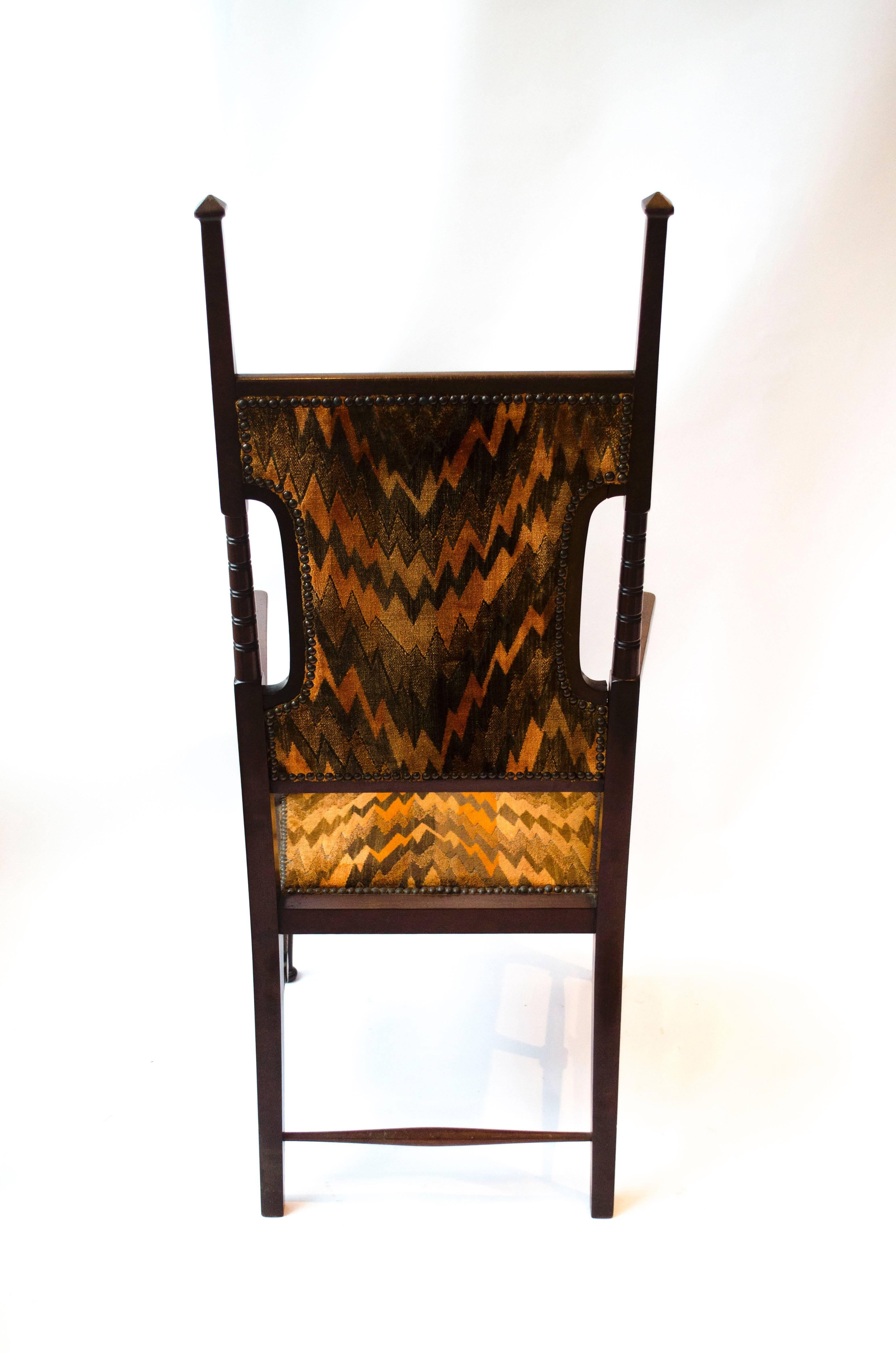 Liberty and Co Attributed. A late Aesthetic Movement Walnut Armchair. In Good Condition For Sale In London, GB