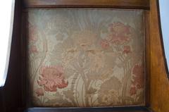 Liberty & Co. An Arts & Crafts Oak Settle in the Style of CFA Voysey