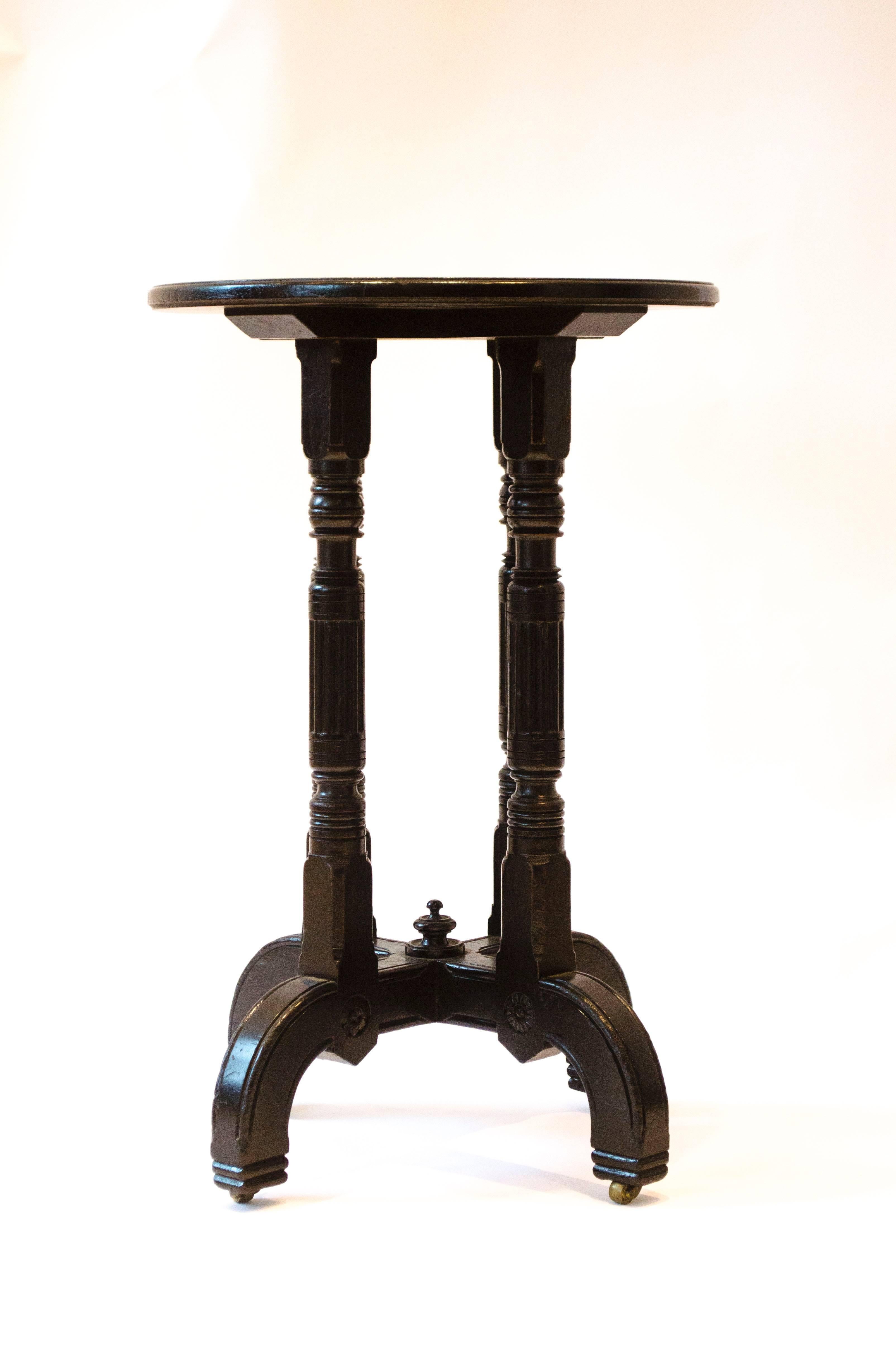 English Bruce Talbert attri, for Gillows & Co. An Aesthetic Movement Circular Wine Table