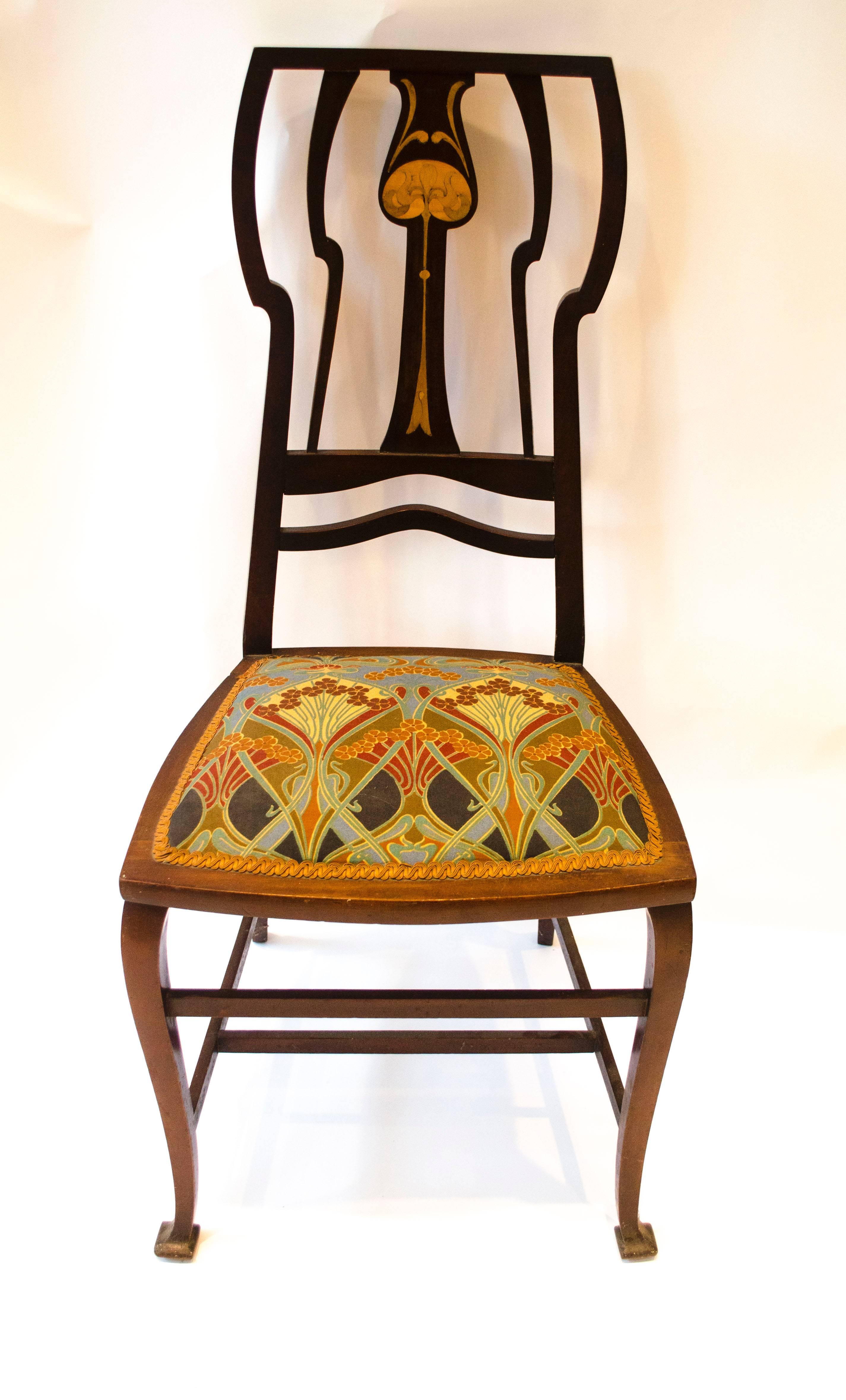 An Arts & Crafts Liberty and Co. inlaid mahogany side chair.