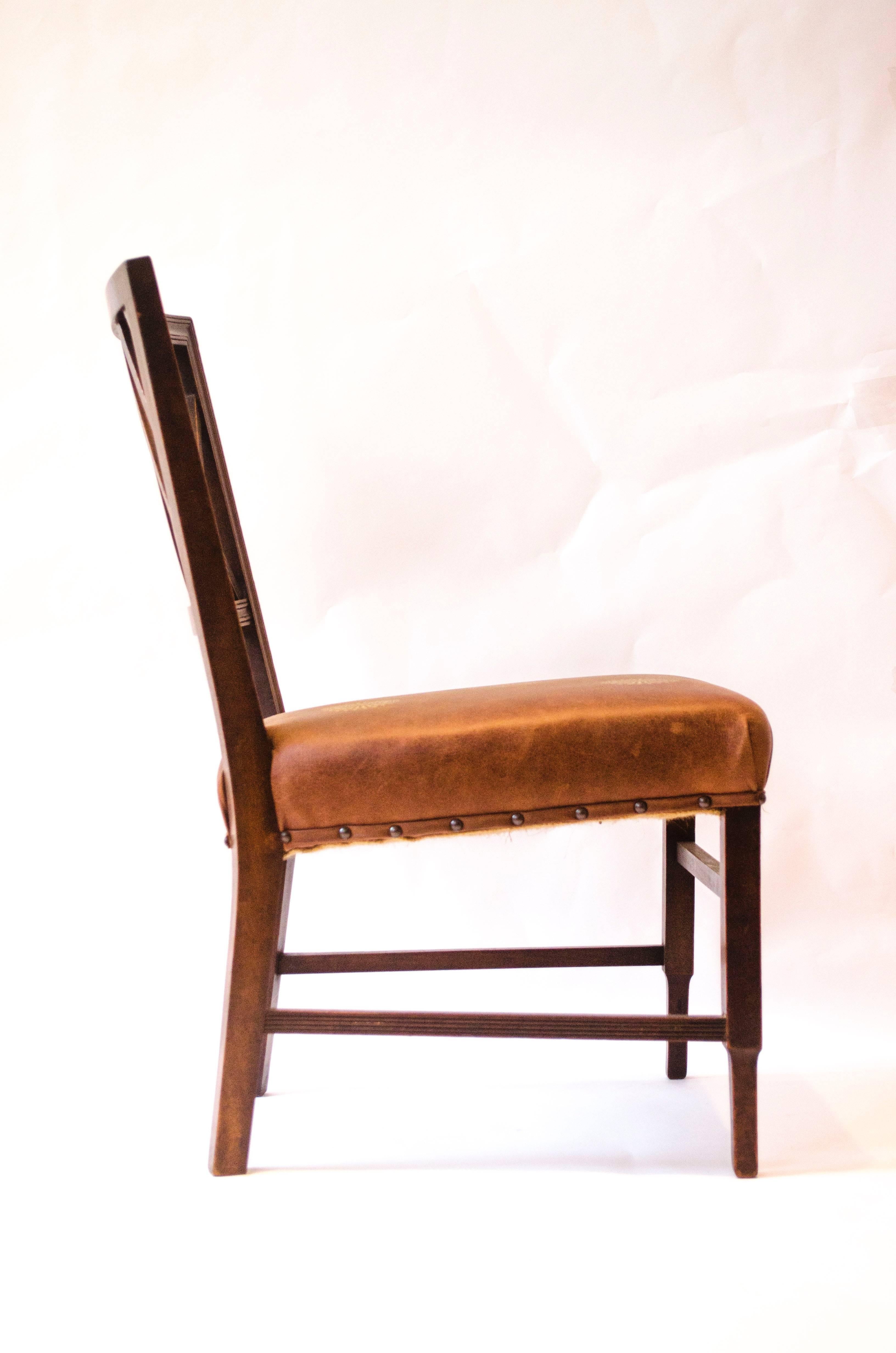Edward William Godwin (attributed), an Anglo-Japanese walnut side chair, circa 1875, probably by William Watt. With a lattice back, a later overstuffed gilt embossed leather seat, on square part-fluted supports. 
See Soros, Susan Weber 'The Secular