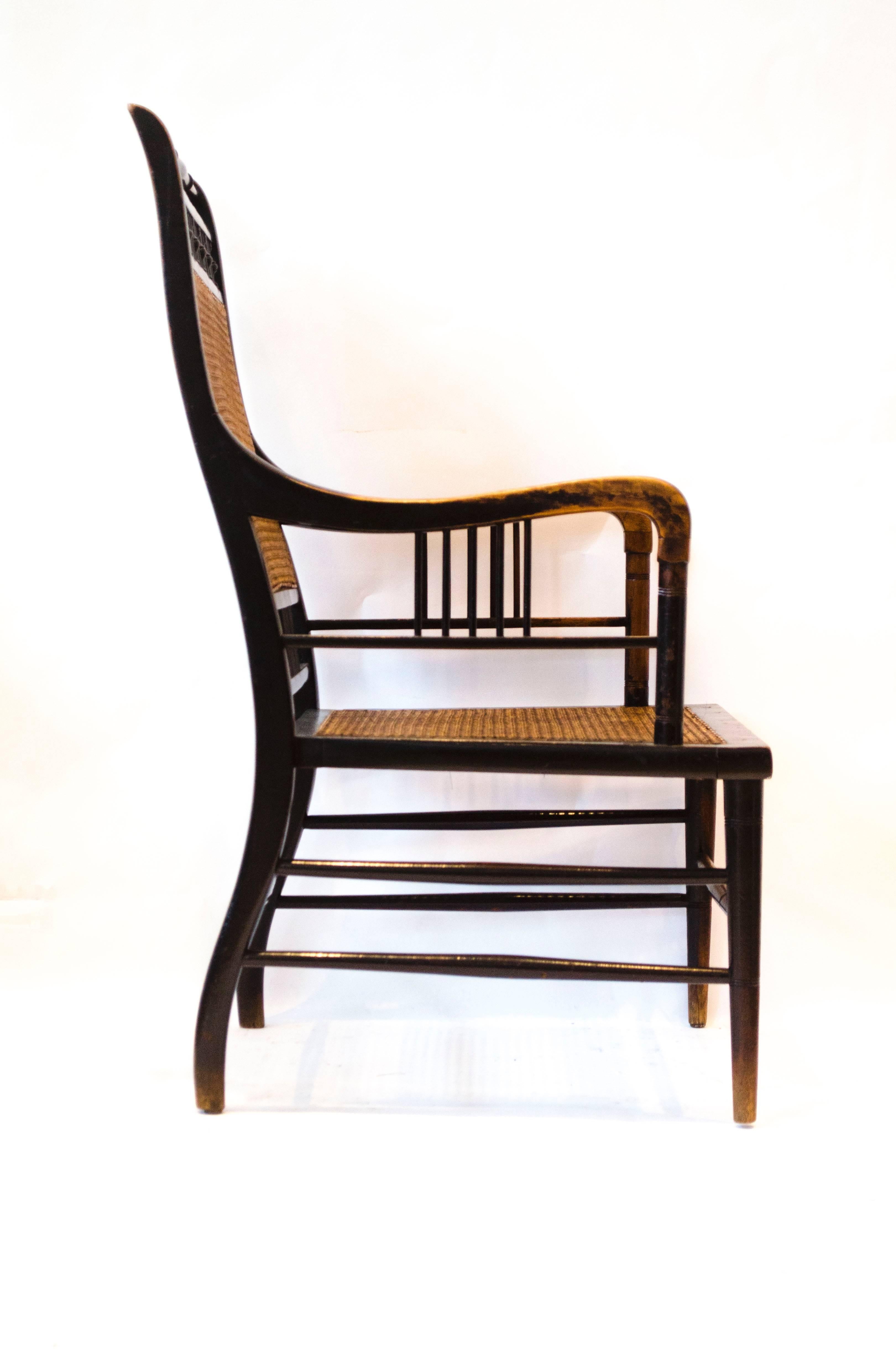 Edward William Godwin (1833-1886) for William Watt.
An ebonized beech and caned armchair. 
An identical armchair with an 'Heirloom' enamel label (William Watts representatives) was purchased by Tony Geering and Martin Wolfson from an auction by