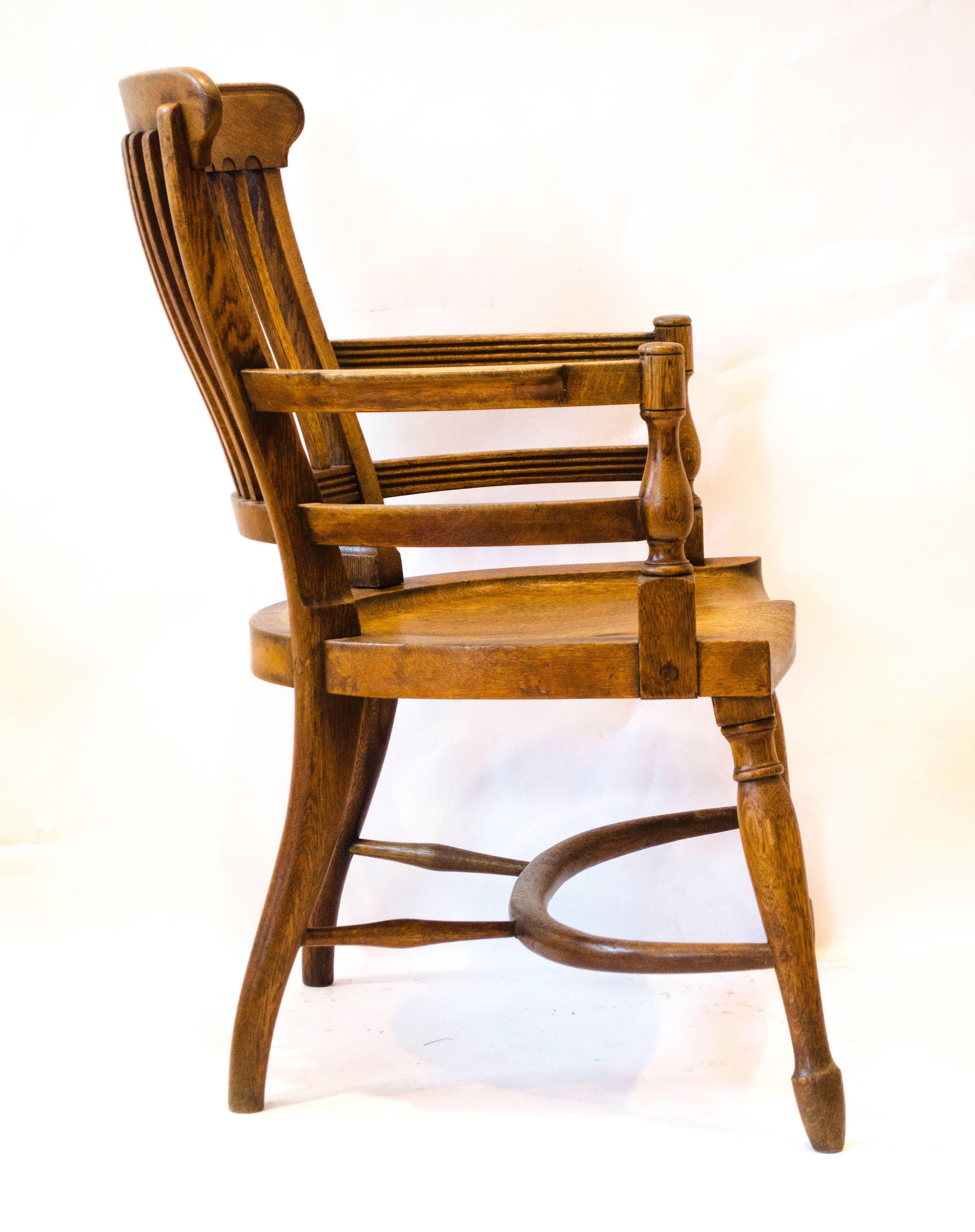 Arts and Crafts E W Godwin. Attr, An oak armchair with shaped back & a crinoline hoop stretcher For Sale